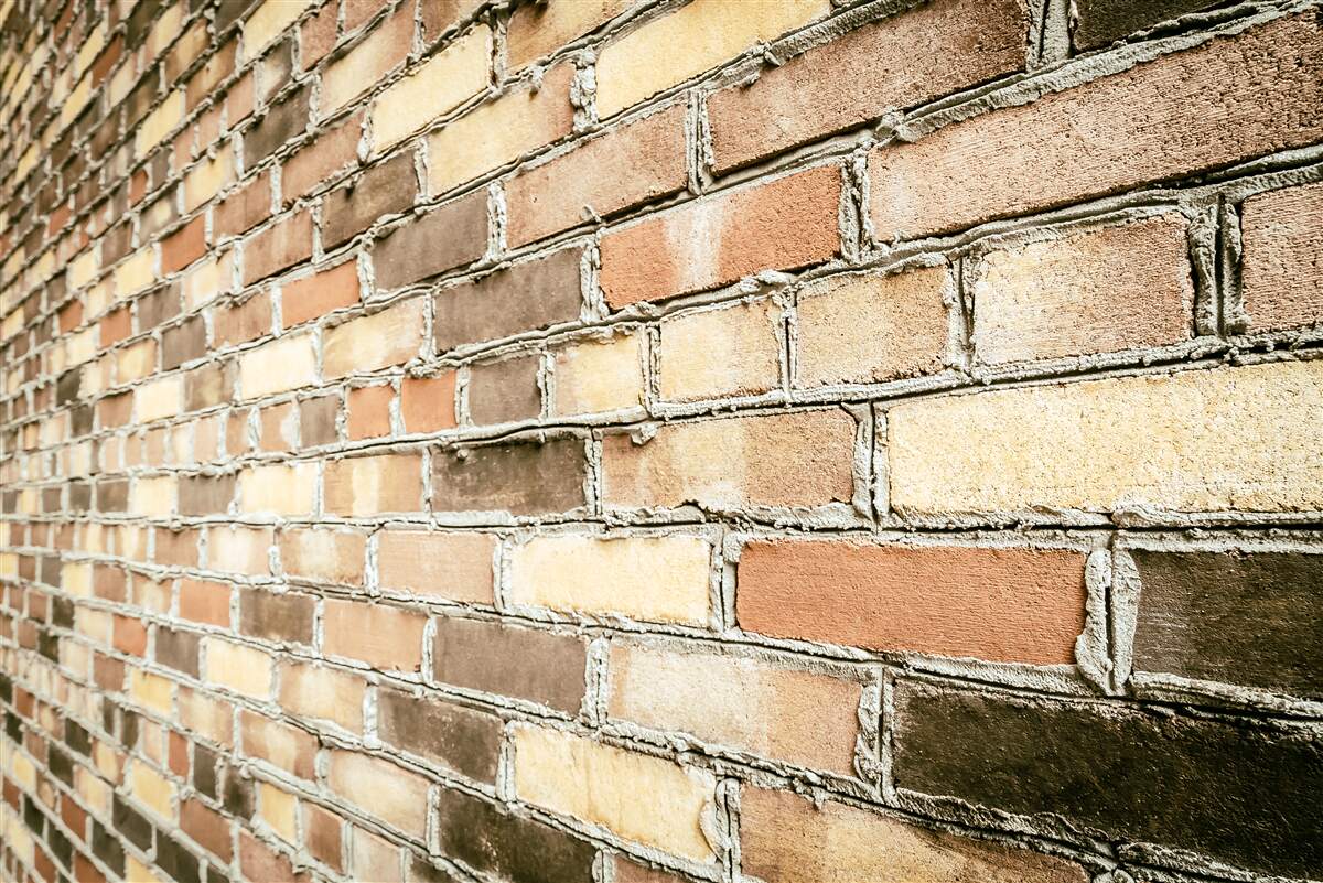 Fotobehang zijaanzicht van bakstenen muur