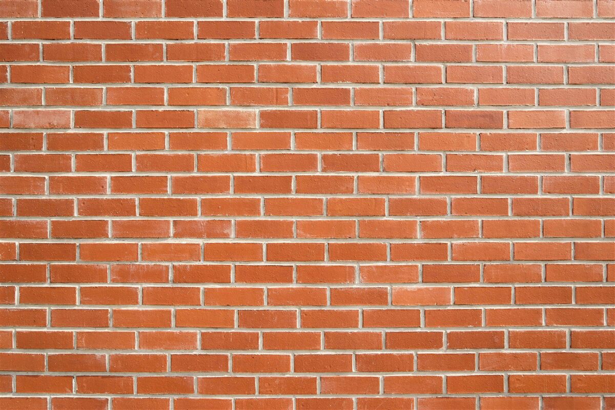 Fotobehang Rode bakstenen muur, glad gelegd