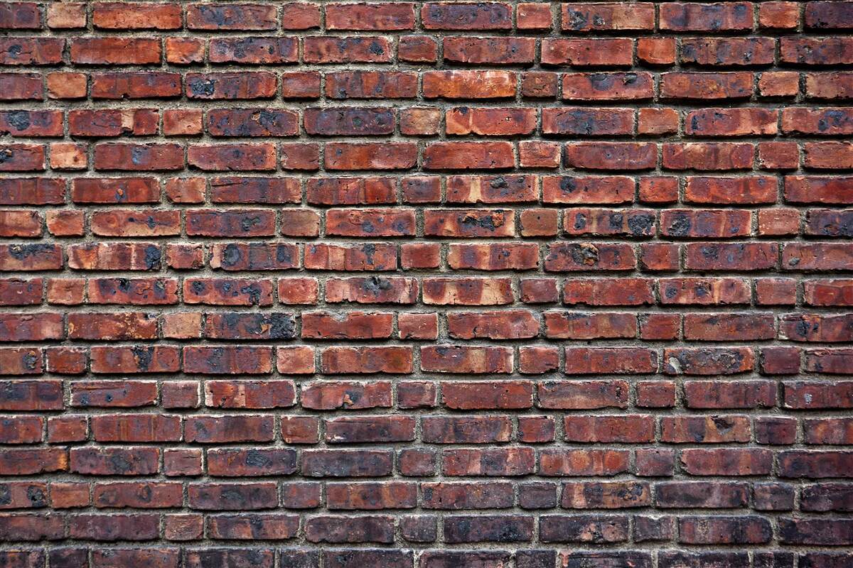 Fotobehang donkere bakstenen muur