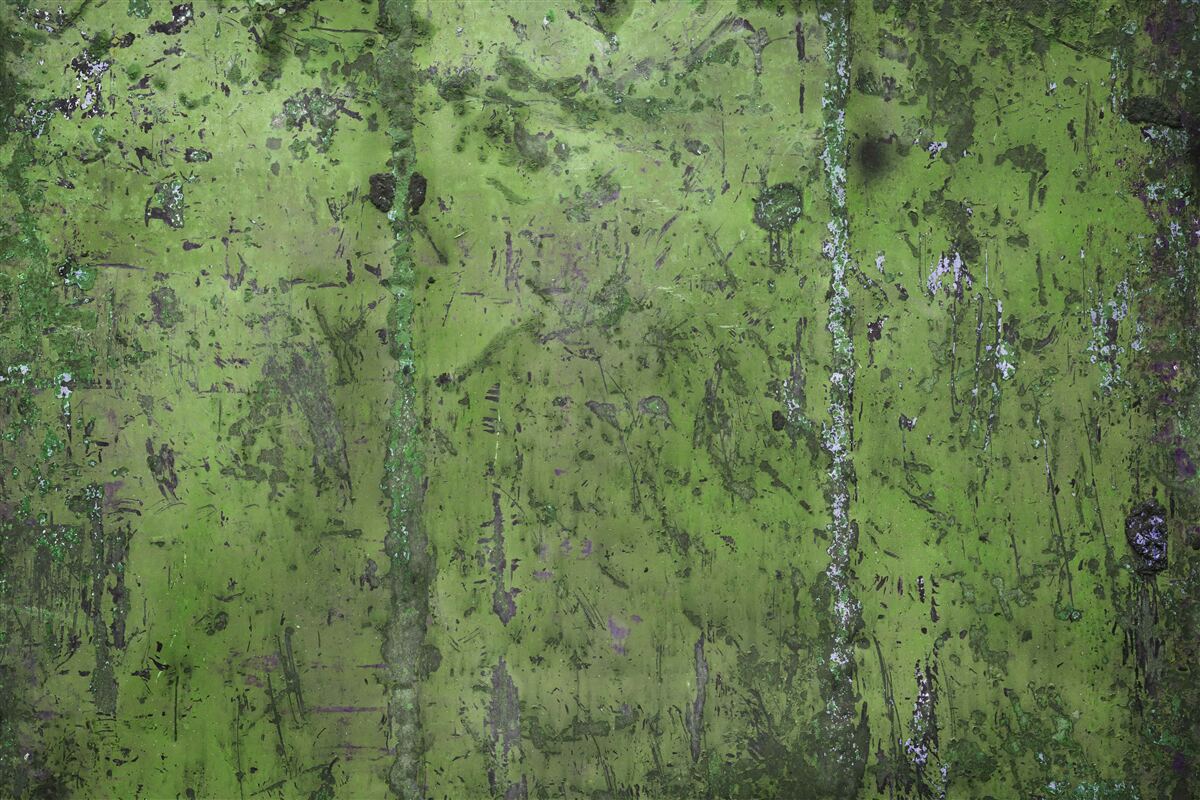 Fotobehang Muur bedekt met groene roest