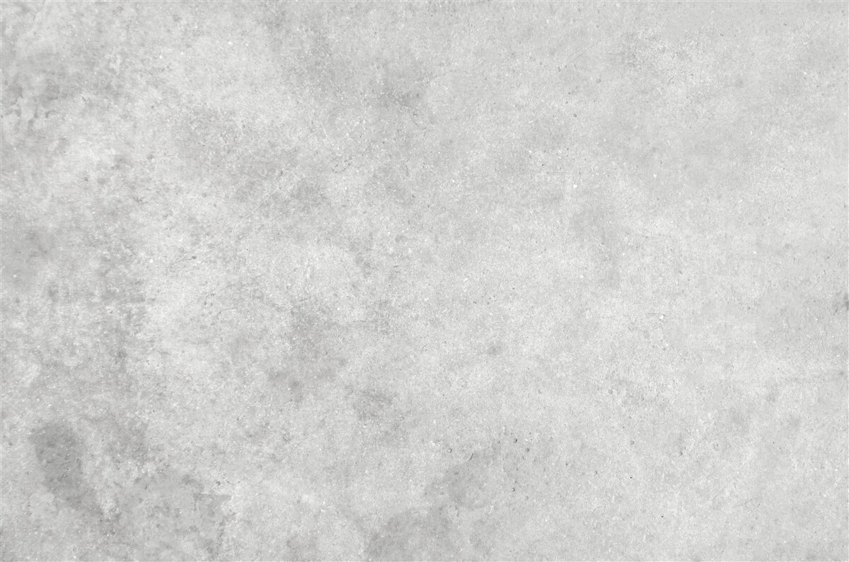 Fotobehang De muur is gemaakt van beton in een lichtgrijze tint