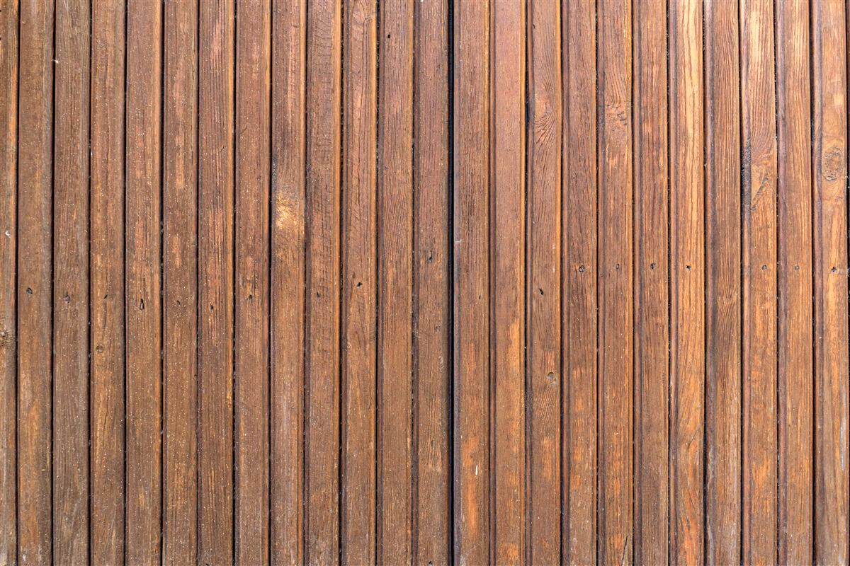 Fotobehang doorlopende barrière van oude houten balken