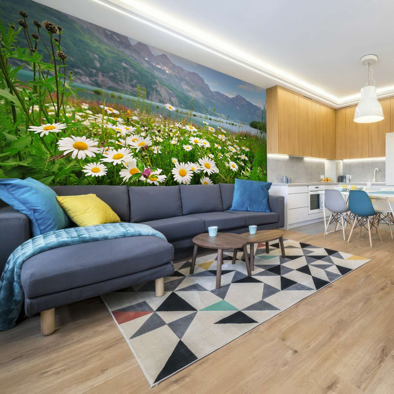 Fotobehang landschap met kamilleveld aan de voet van de bergen