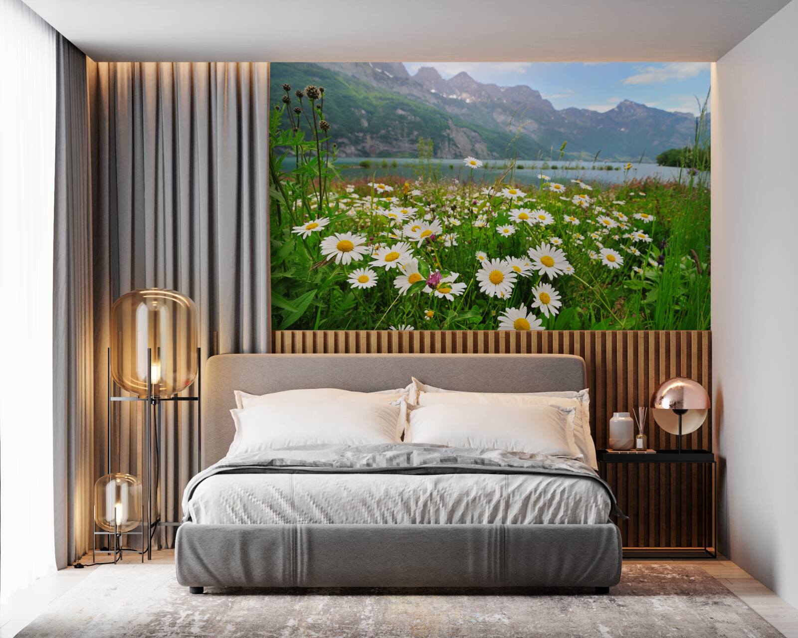 Fotobehang landschap met kamilleveld aan de voet van de bergen