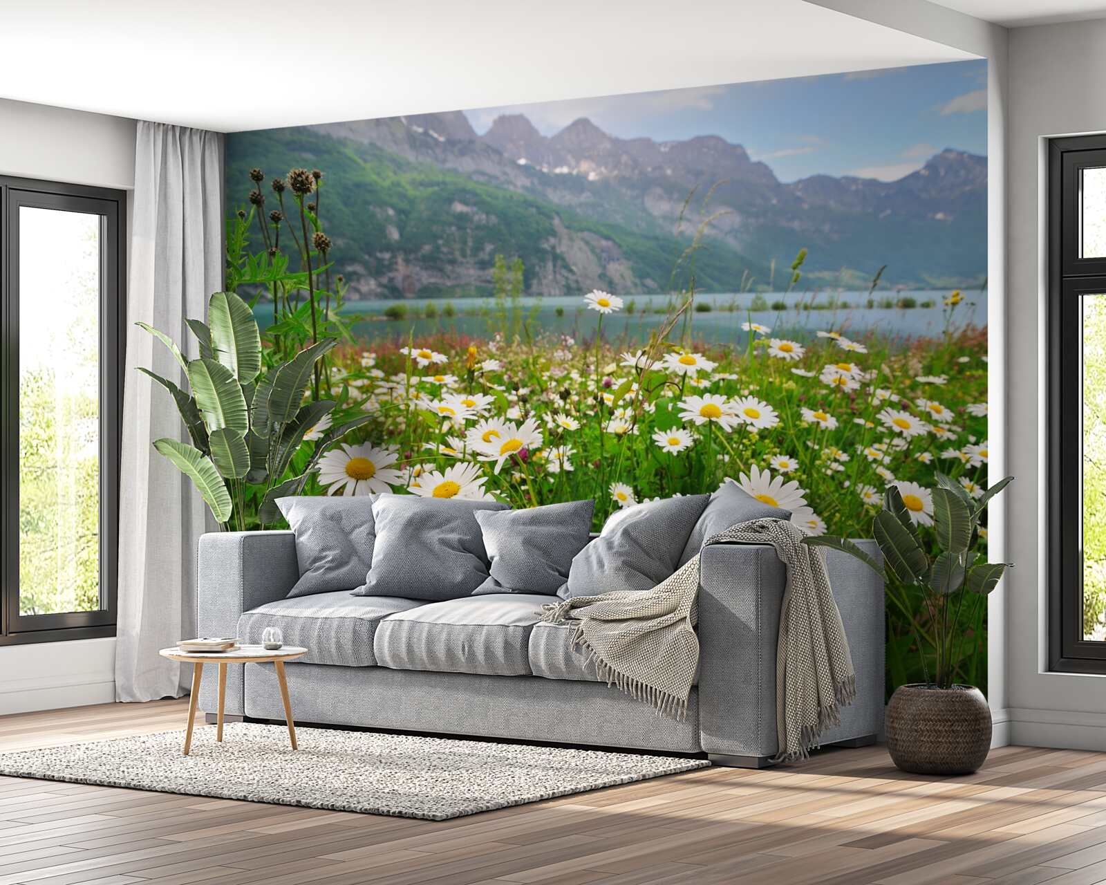 Fotobehang landschap met kamilleveld aan de voet van de bergen