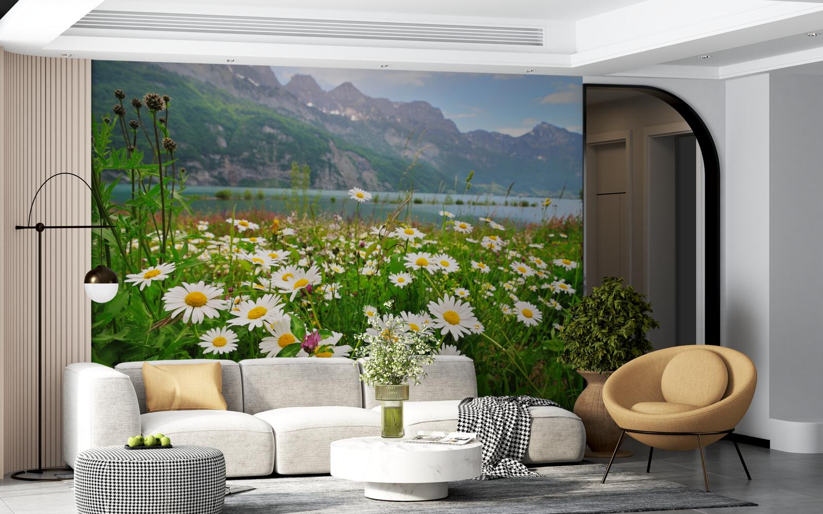 Fotobehang landschap met kamilleveld aan de voet van de bergen