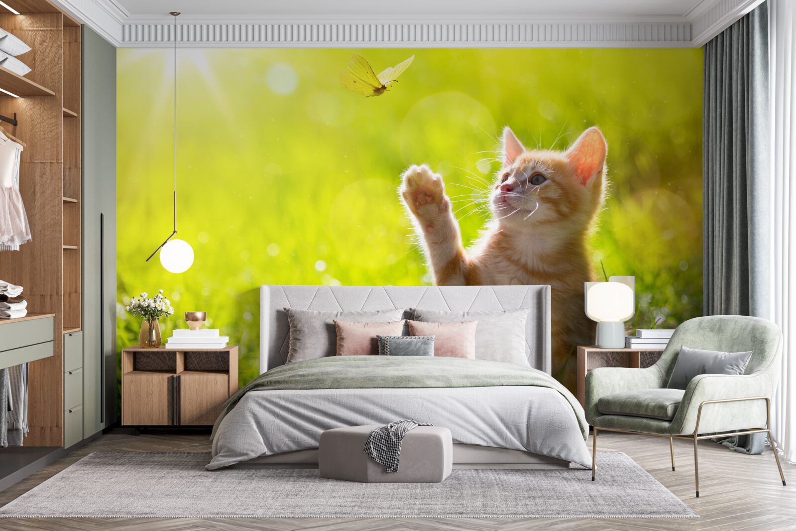Fotobehang een kleine kat speelt met een vlinder in een groen veld