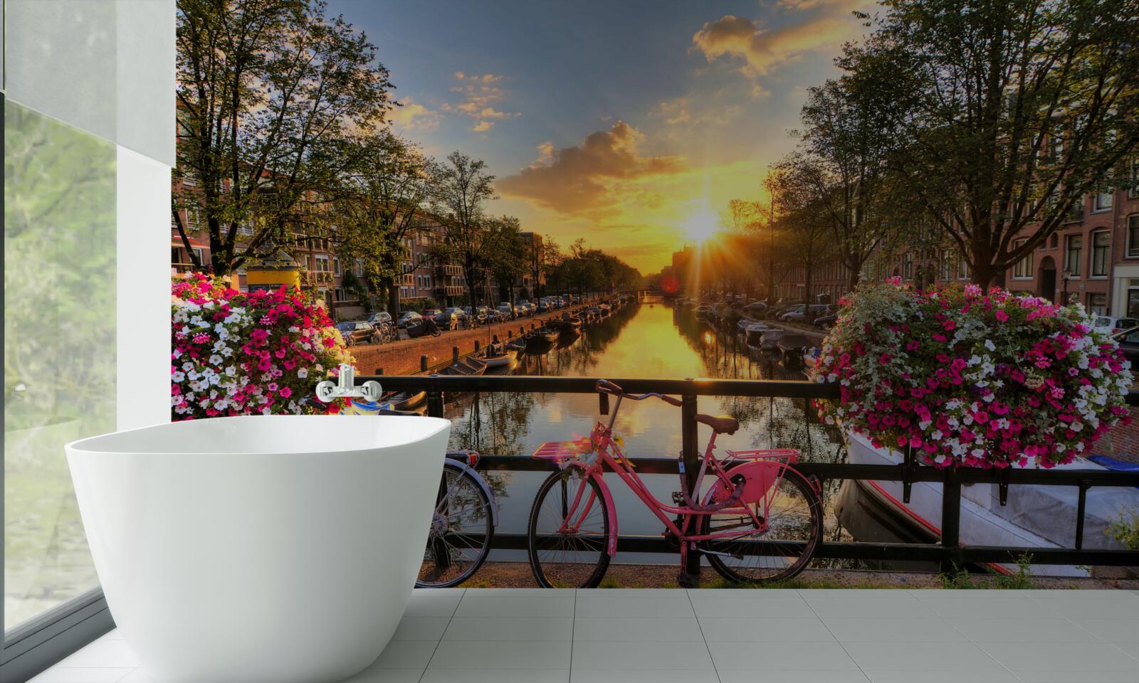 Fotobehang zonsondergang in amsterdam met fietsen op de achtergrond