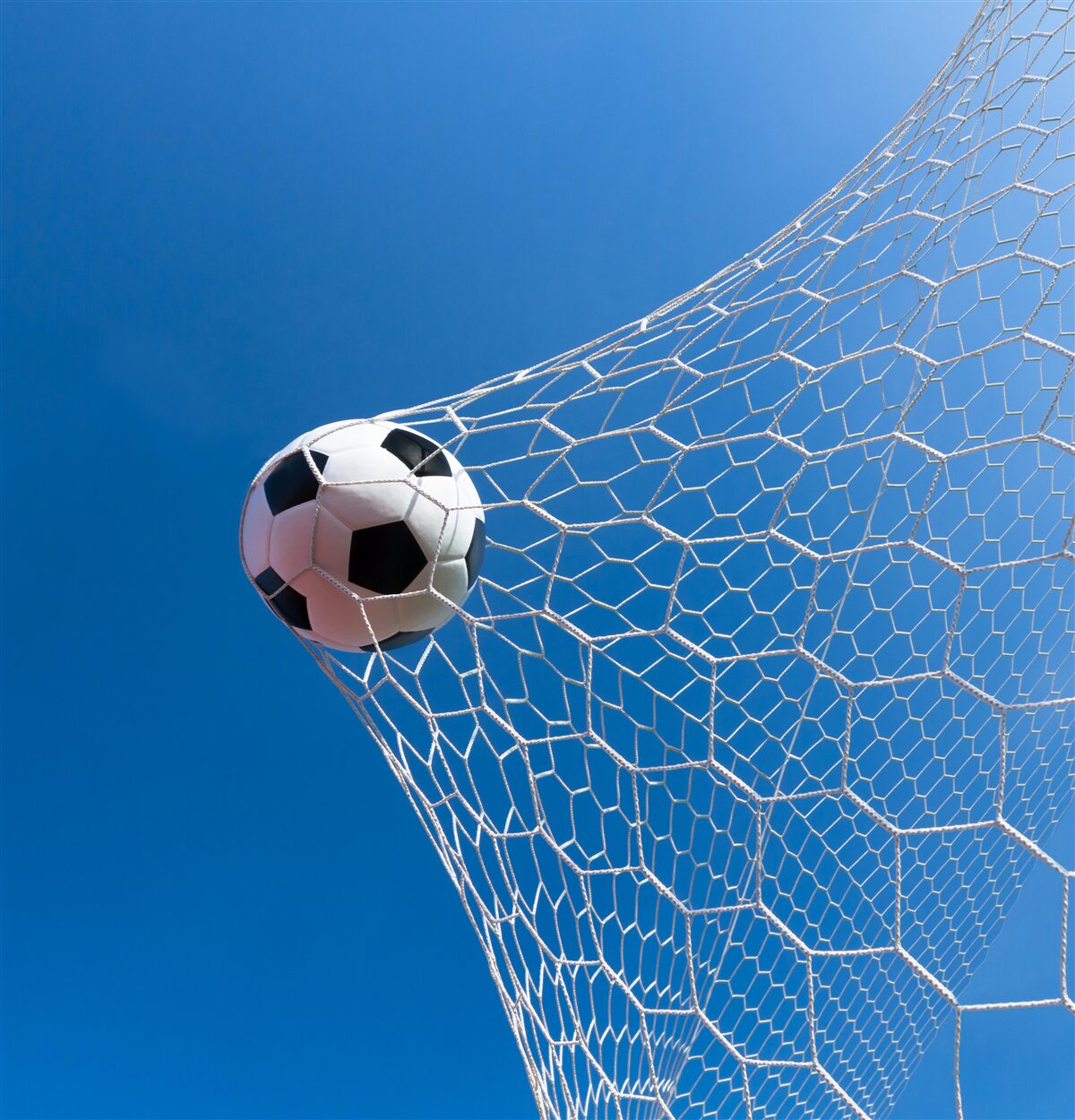 Fotobehang de bal belandde in het doel