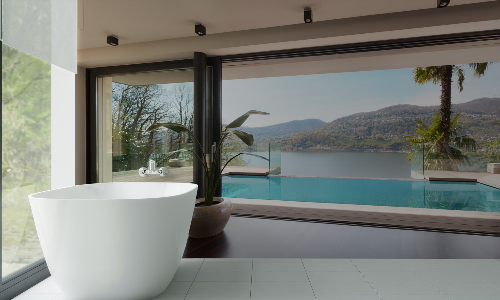 Fotobehang exclusief zwembad met panoramisch uitzicht op de bergketen