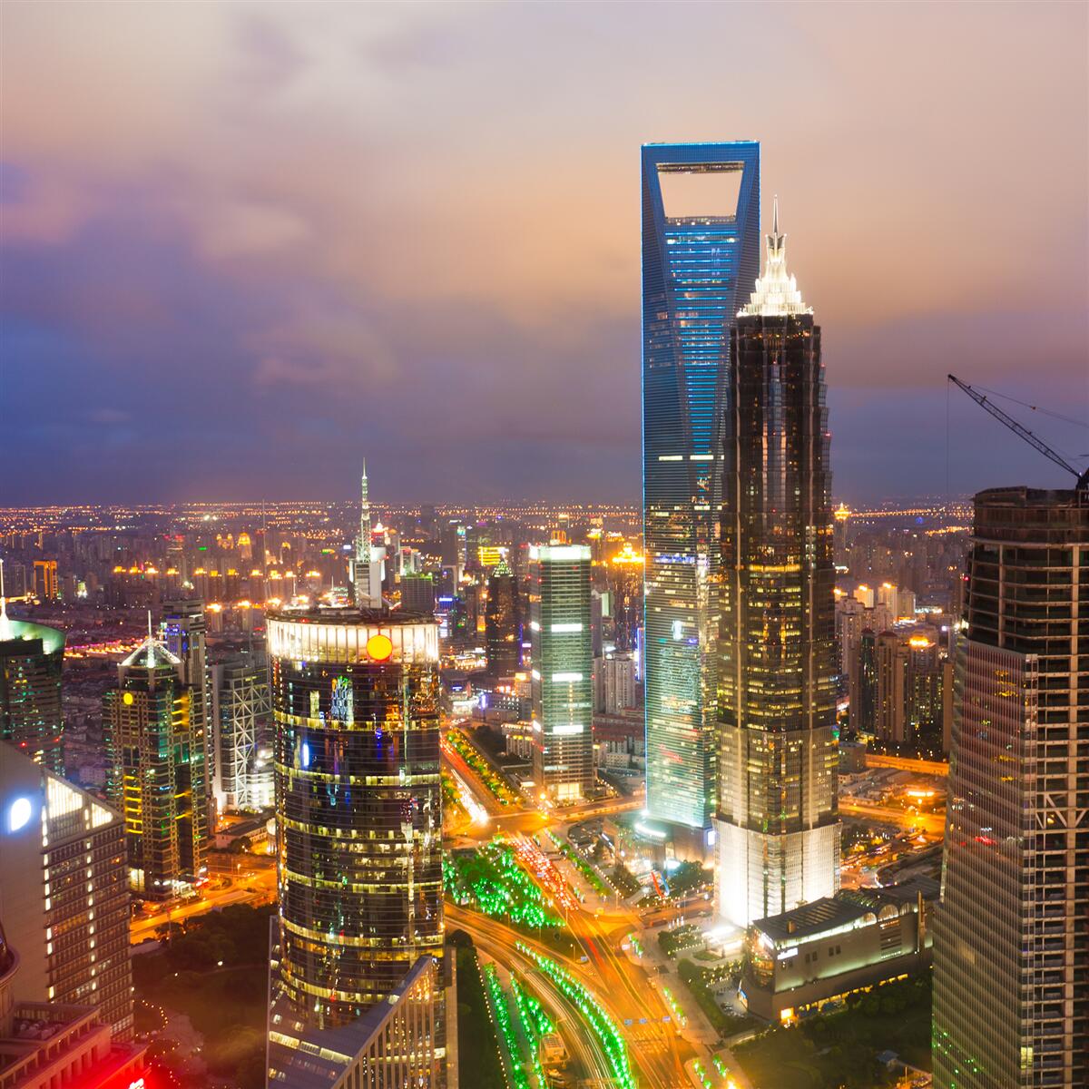 Fotobehang nachtelijke toppen van stadsgebouwen