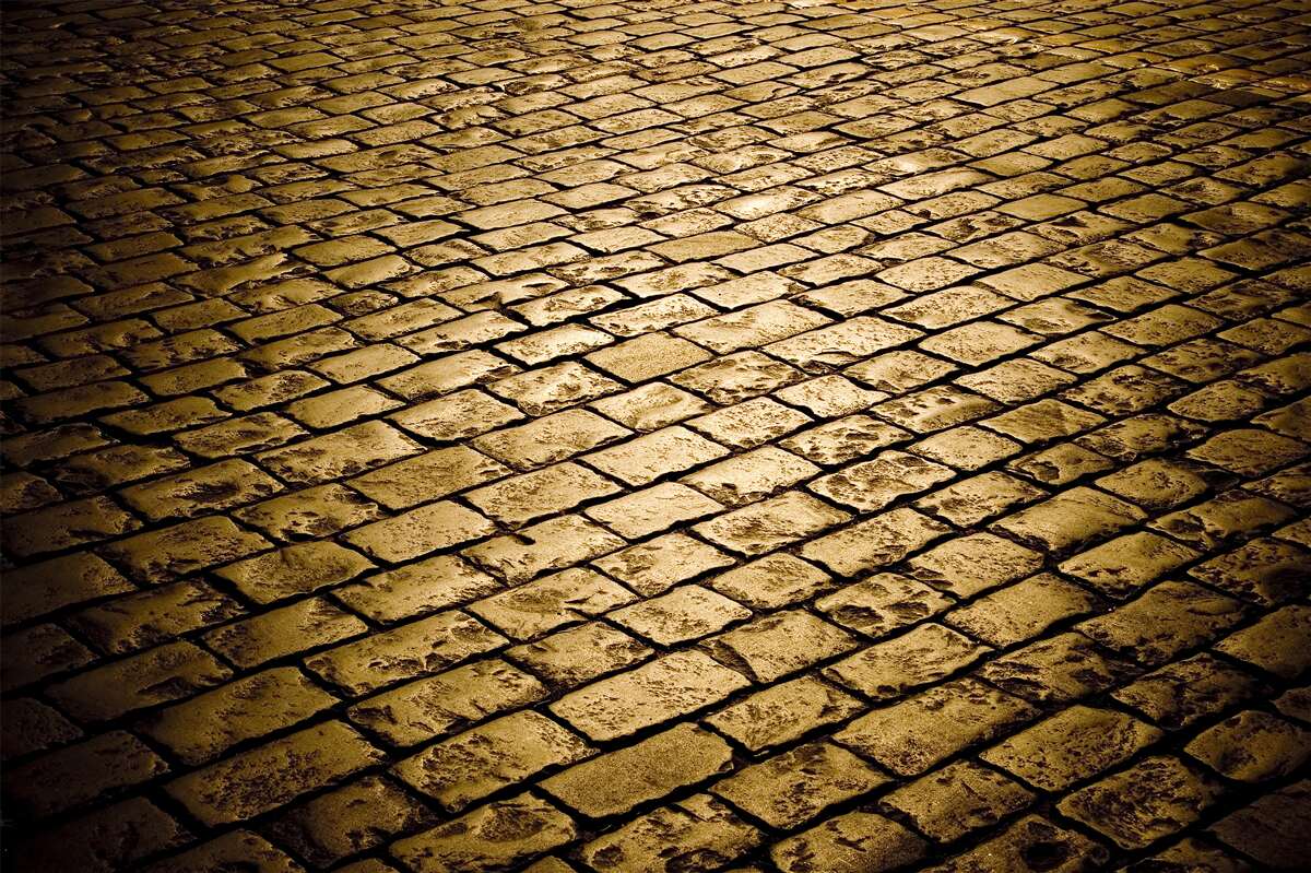 Fotobehang straatstenen gelegd in de avond