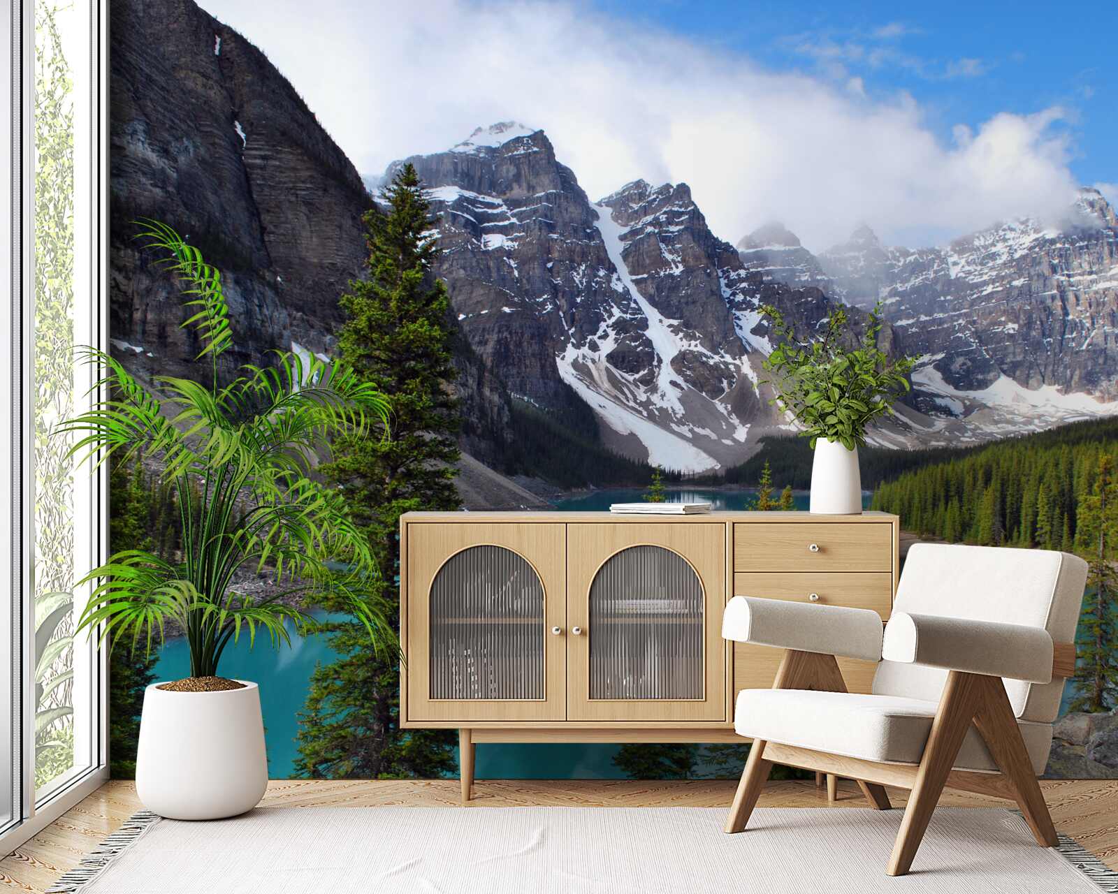 Fotobehang een meer met blauw water aan de voet van bergtoppen