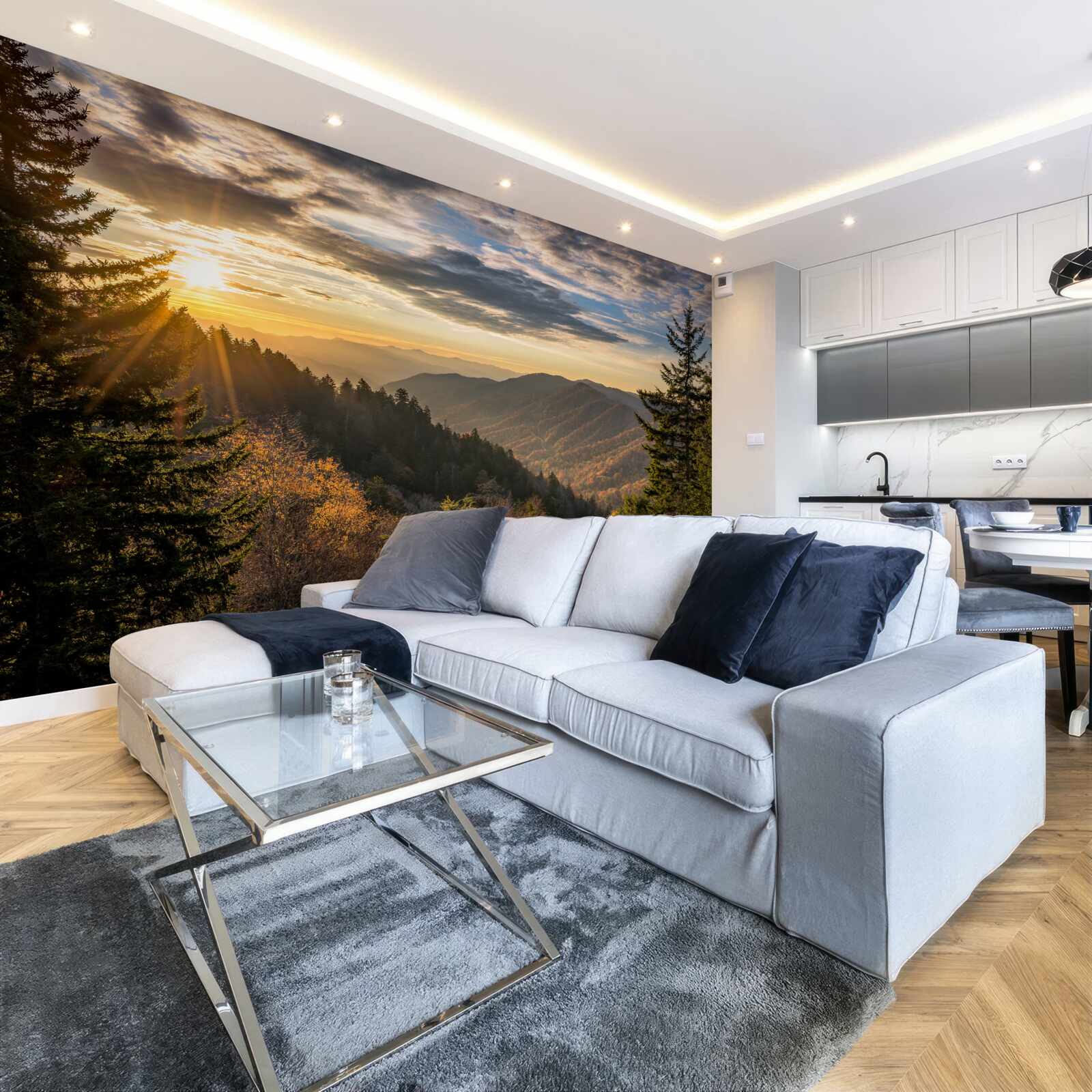 Fotobehang de ondergaande zon over de bergtoppen