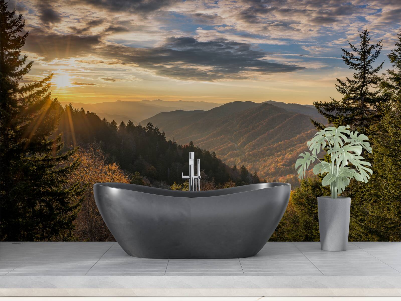 Fotobehang de ondergaande zon over de bergtoppen