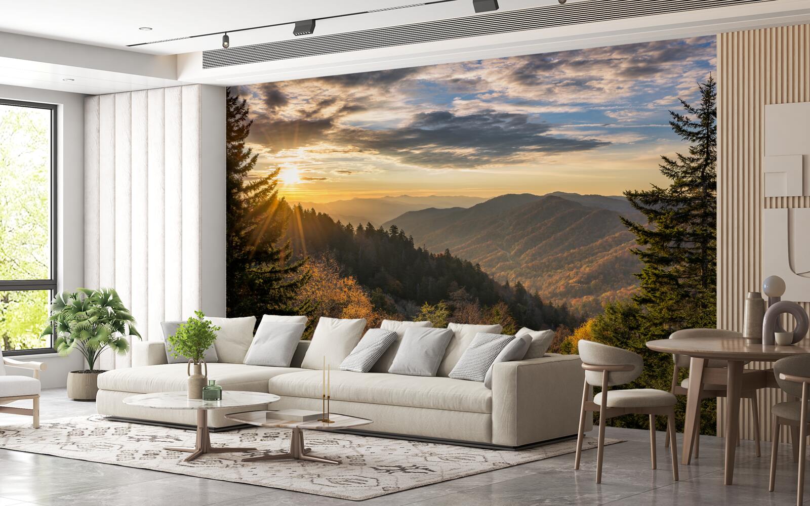 Fotobehang de ondergaande zon over de bergtoppen