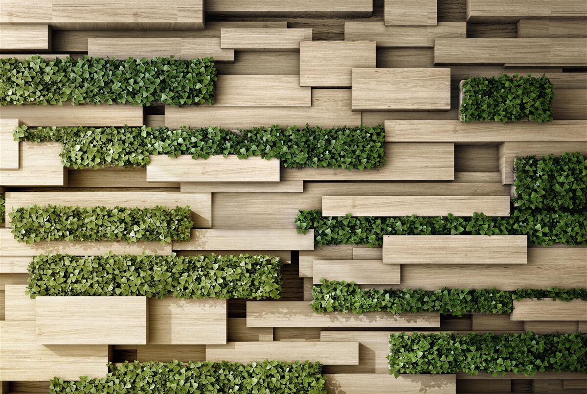 Fotobehang stenen muur versierd met groene planten