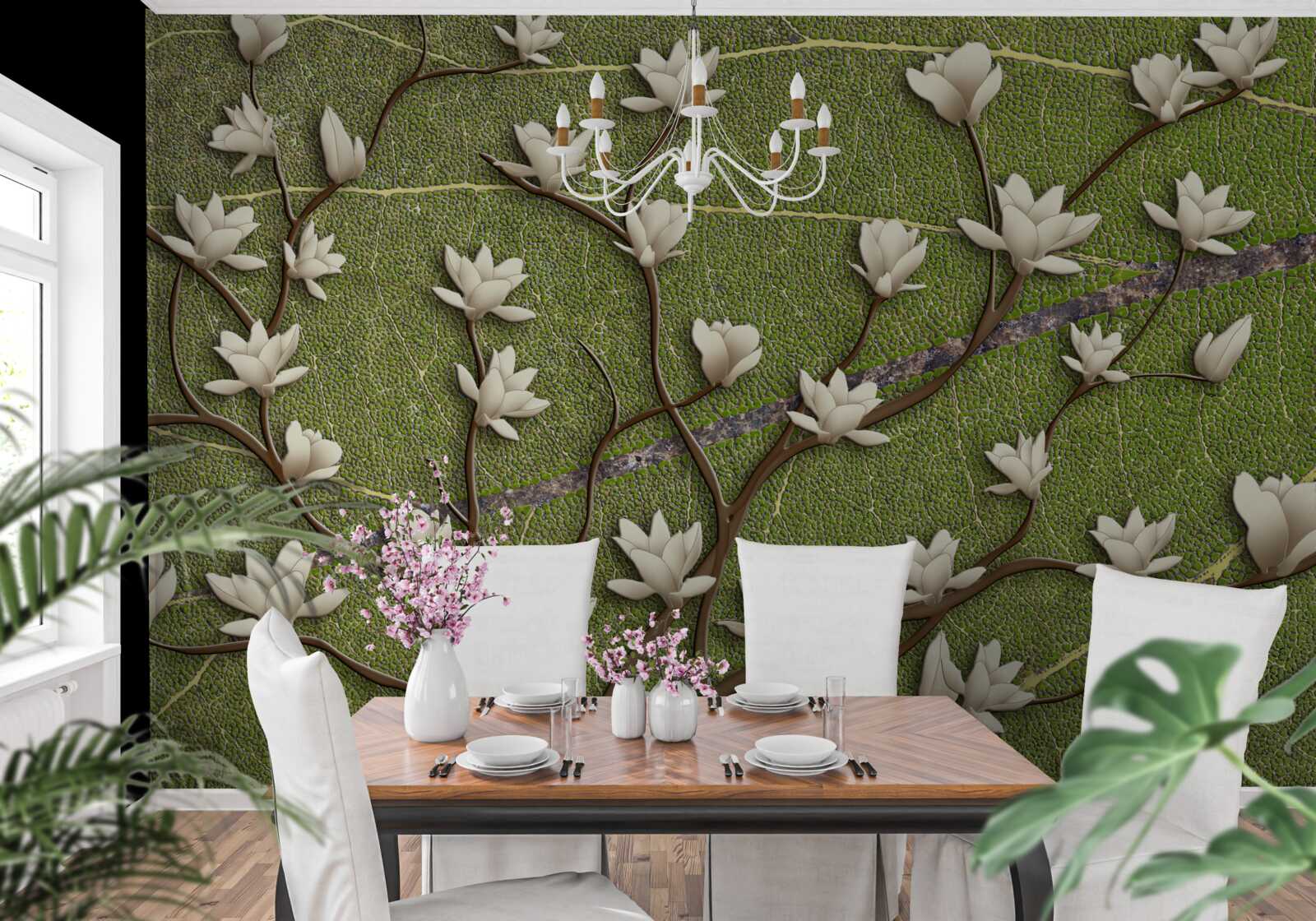 Fotobehang Sneeuwwitte magnolia takken op een groene achtergrond