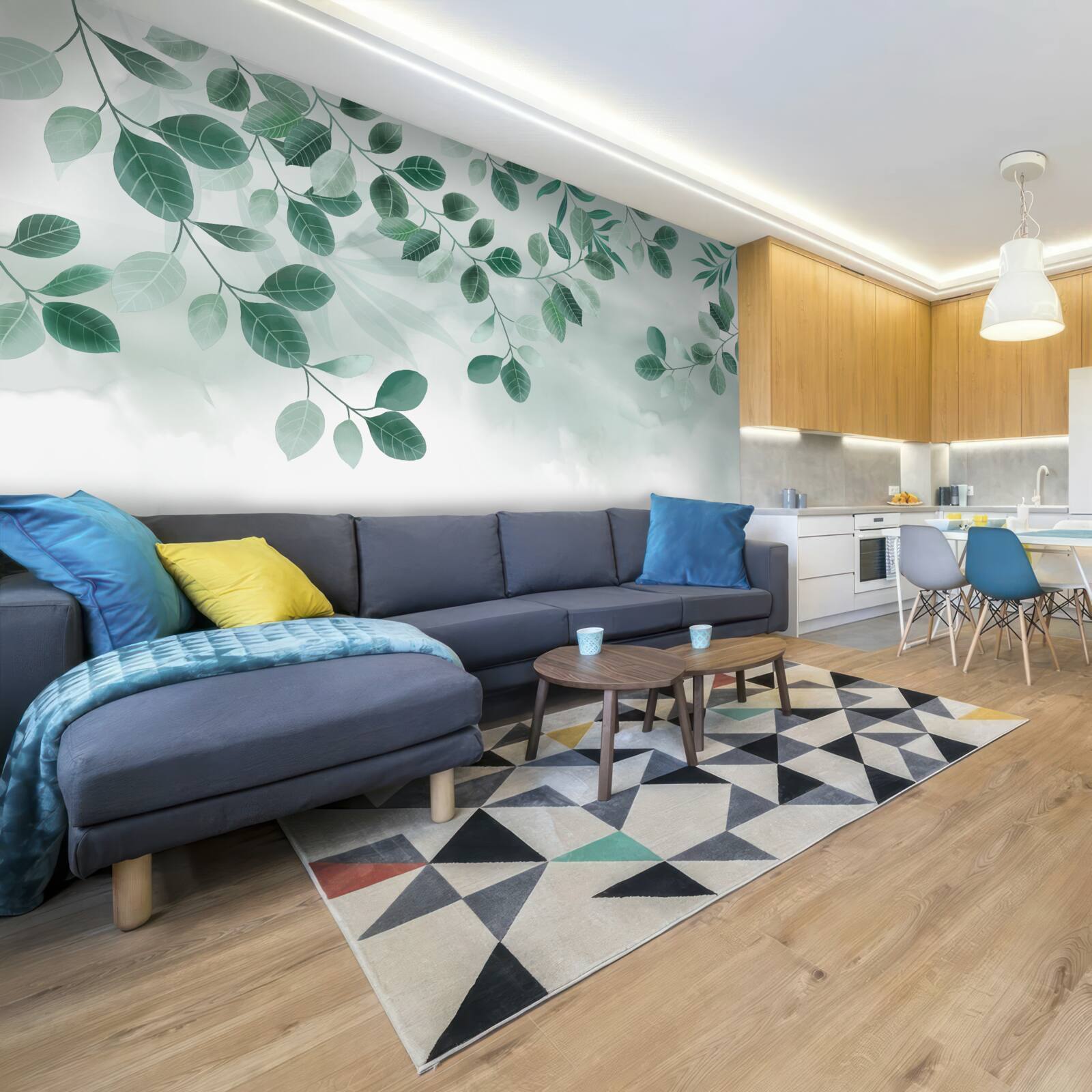 Fotobehang takken met groene bladeren tegen de lucht