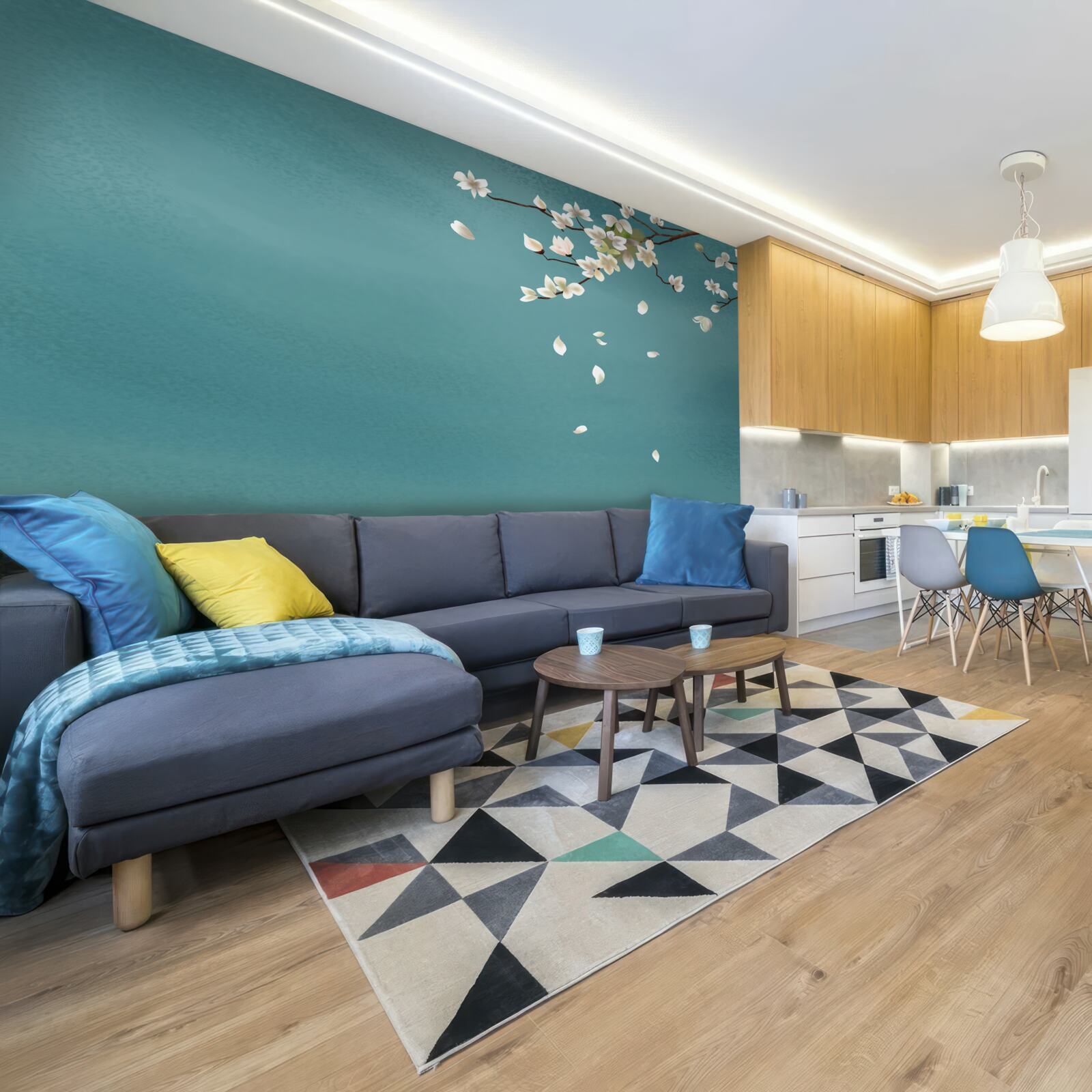 Fotobehang turquoise achtergrond versierd met een bloeiende boom