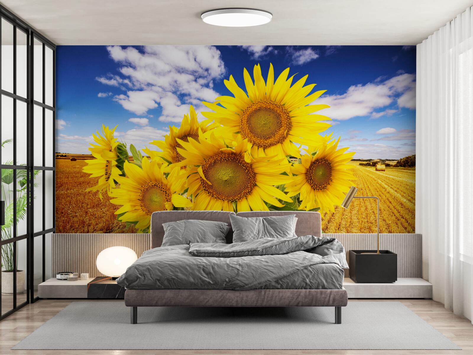 Fotobehang een boeket zonnebloemen is te zien tegen de lucht en een tarweveld