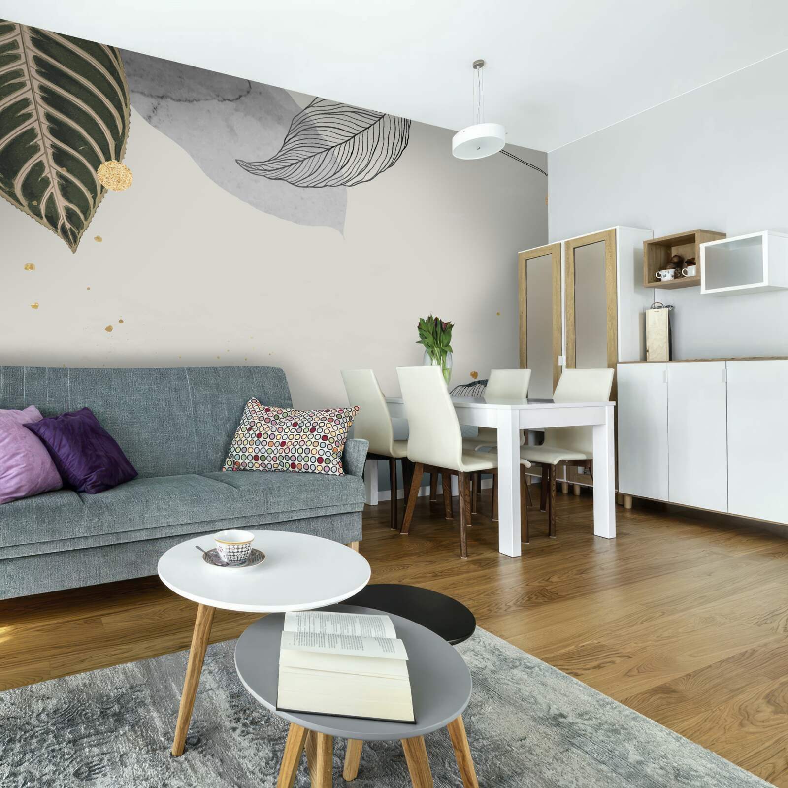 Fotobehang grote tropische bladeren op een grijze achtergrond