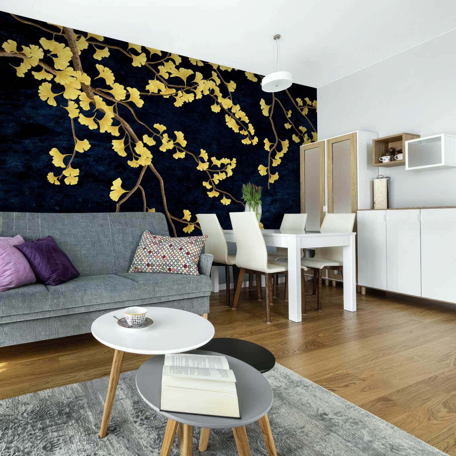 Fotobehang takken van gele bladeren tegen de nachtelijke hemel