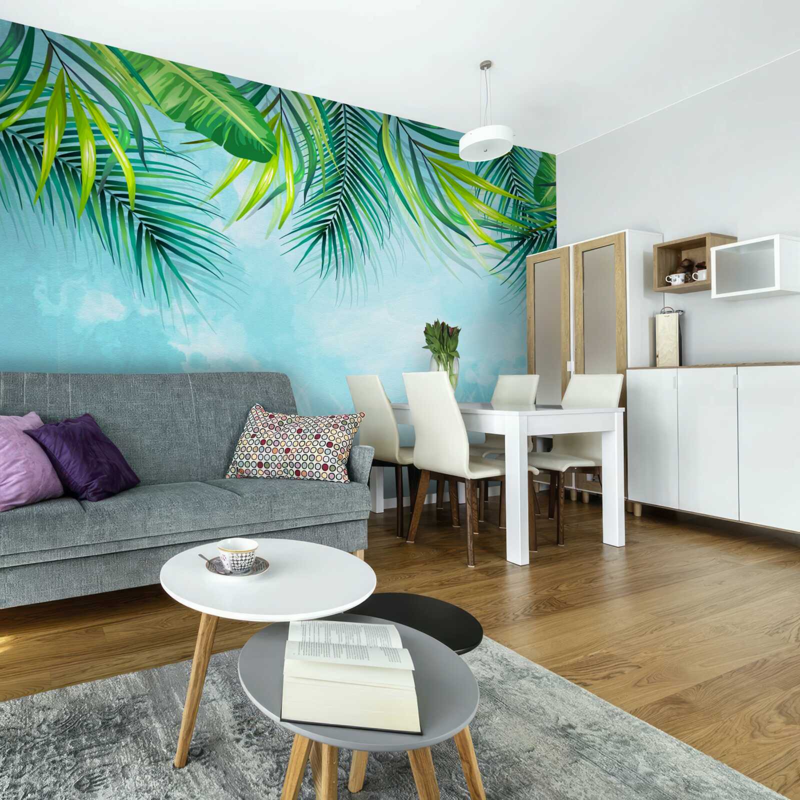 Fotobehang tropische bladeren tegen een blauwe lucht