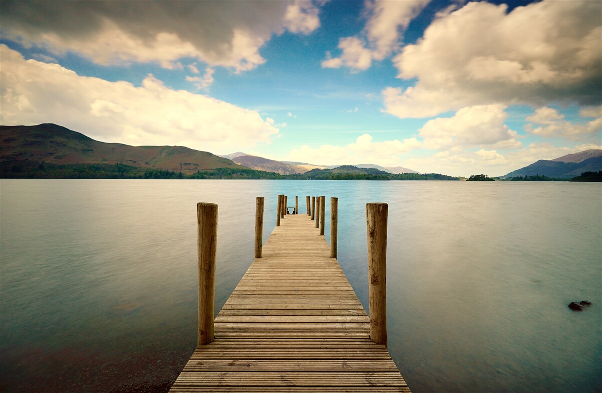 Fotobehang houten pier aan de kust
