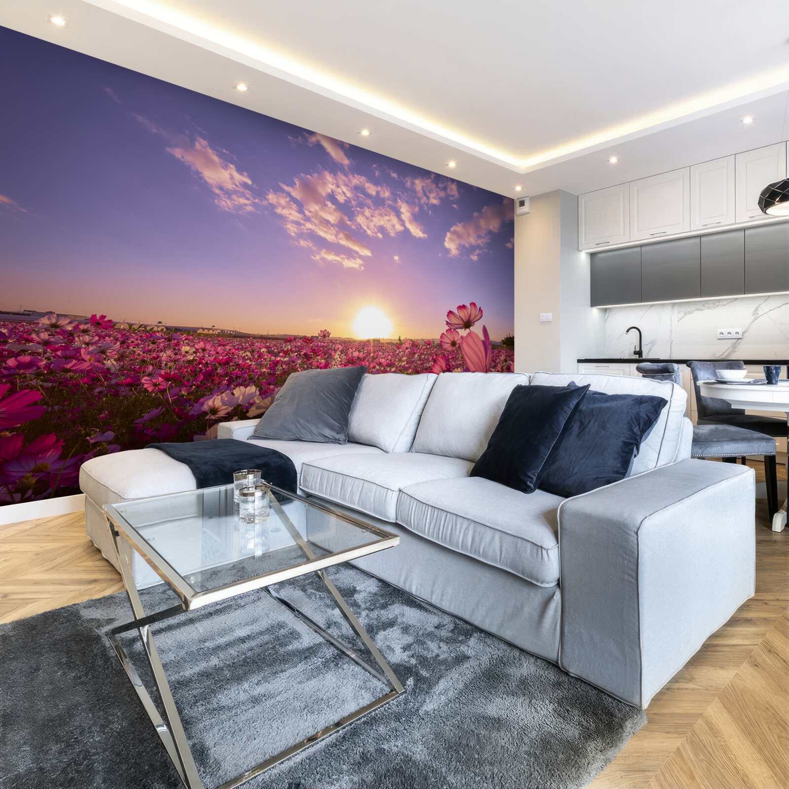 Fotobehang Dageraad boven een veld vol bloemen