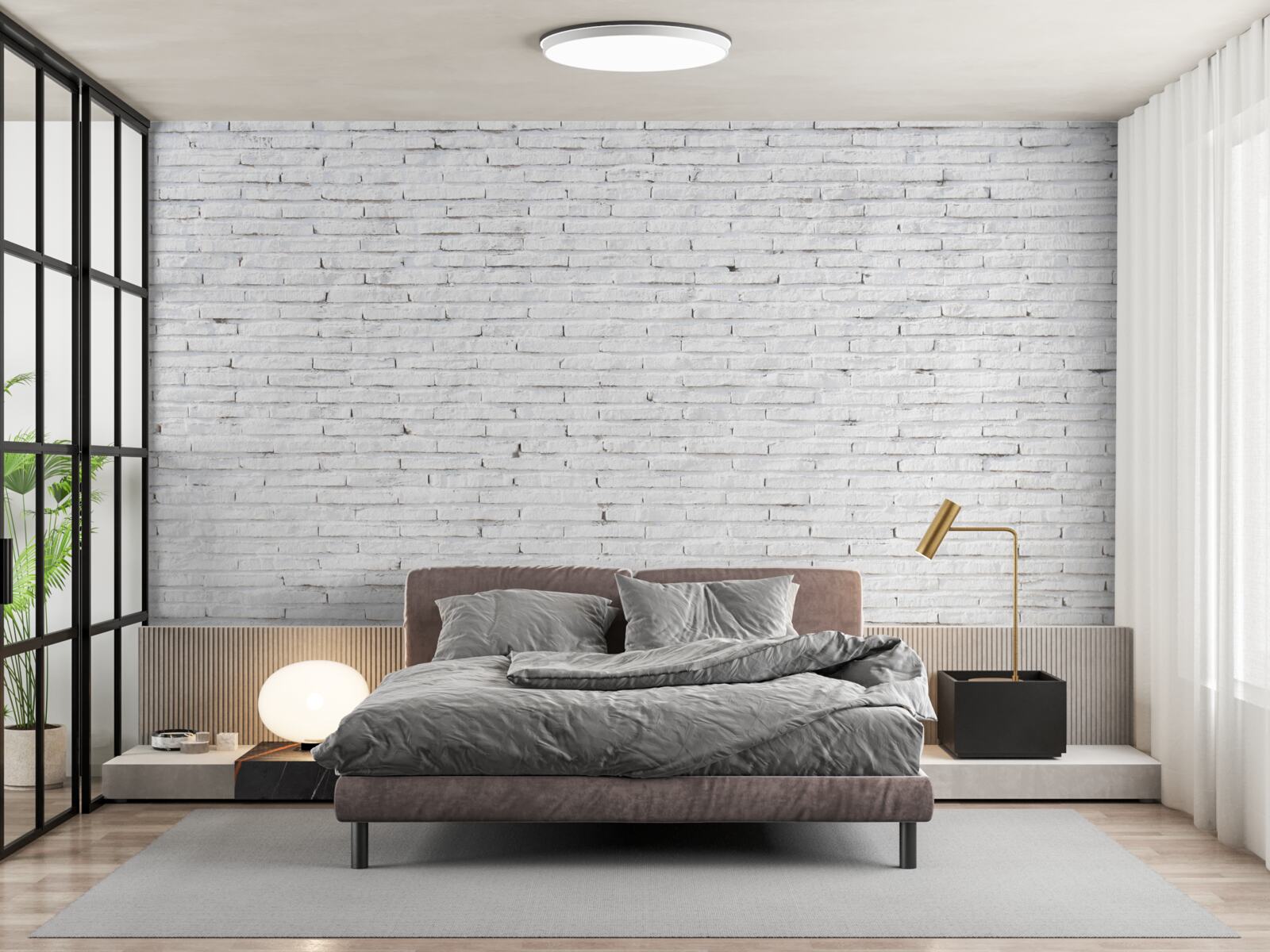 Fotobehang De muur is van baksteen, met een perfecte witte