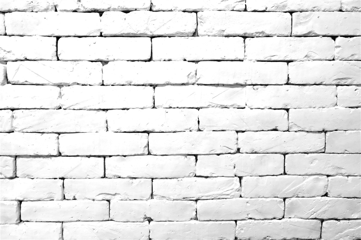 Fotobehang Bakstenen muur, zorgvuldig bewerkt in wit