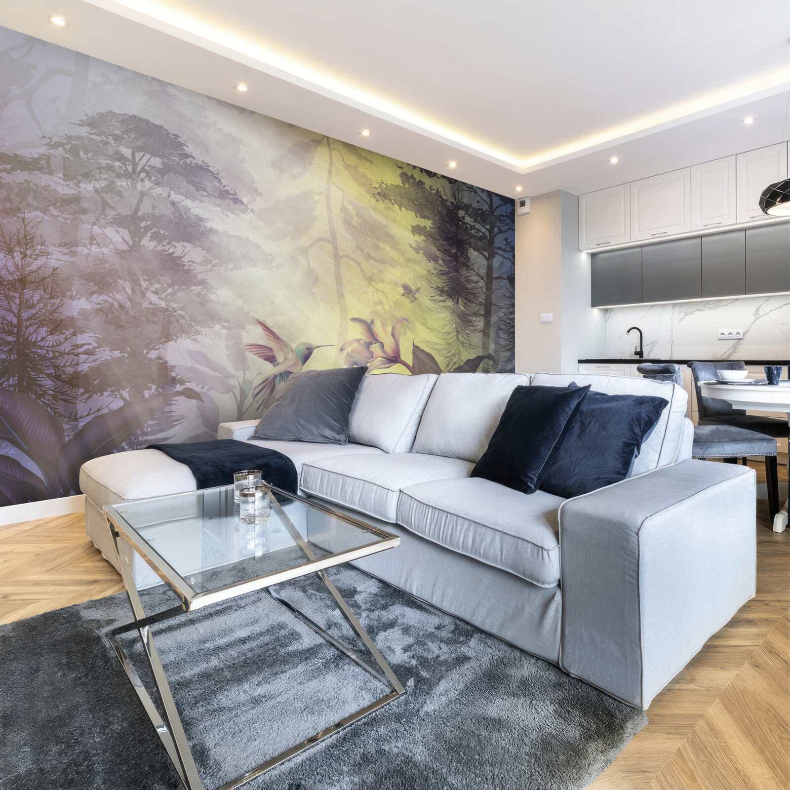 Fotobehang een bos loofbomen onder zonnestralen