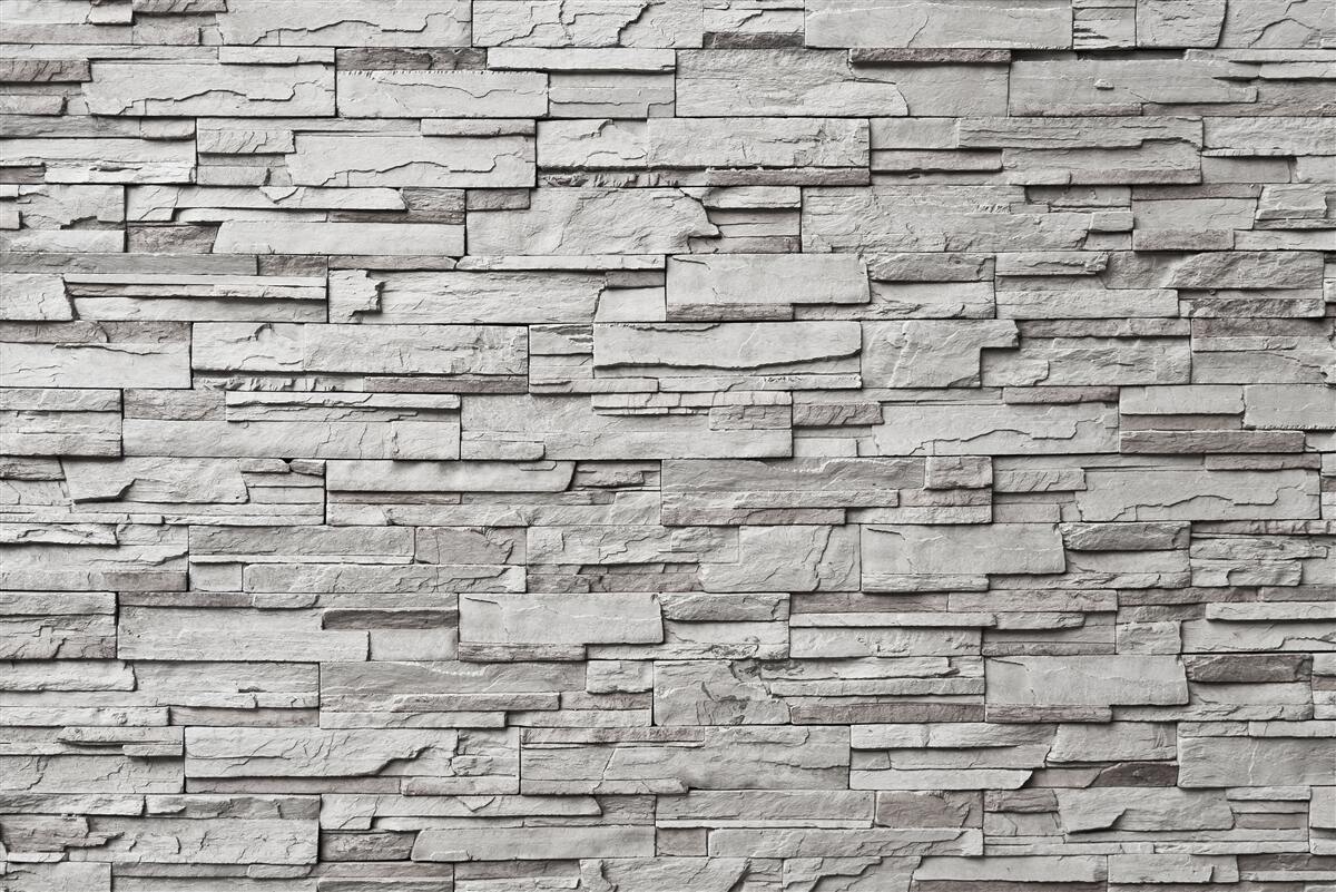 Fotobehang witte stenen muur