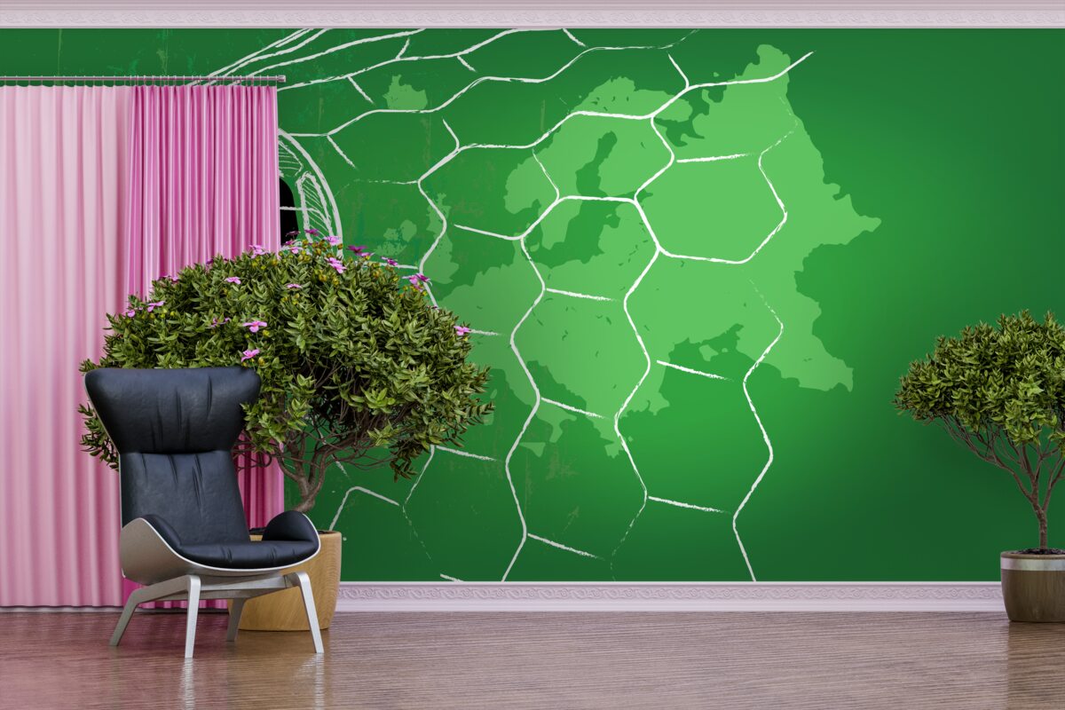 Fotobehang contour van een voetbal en een net tegen een groene achtergrond