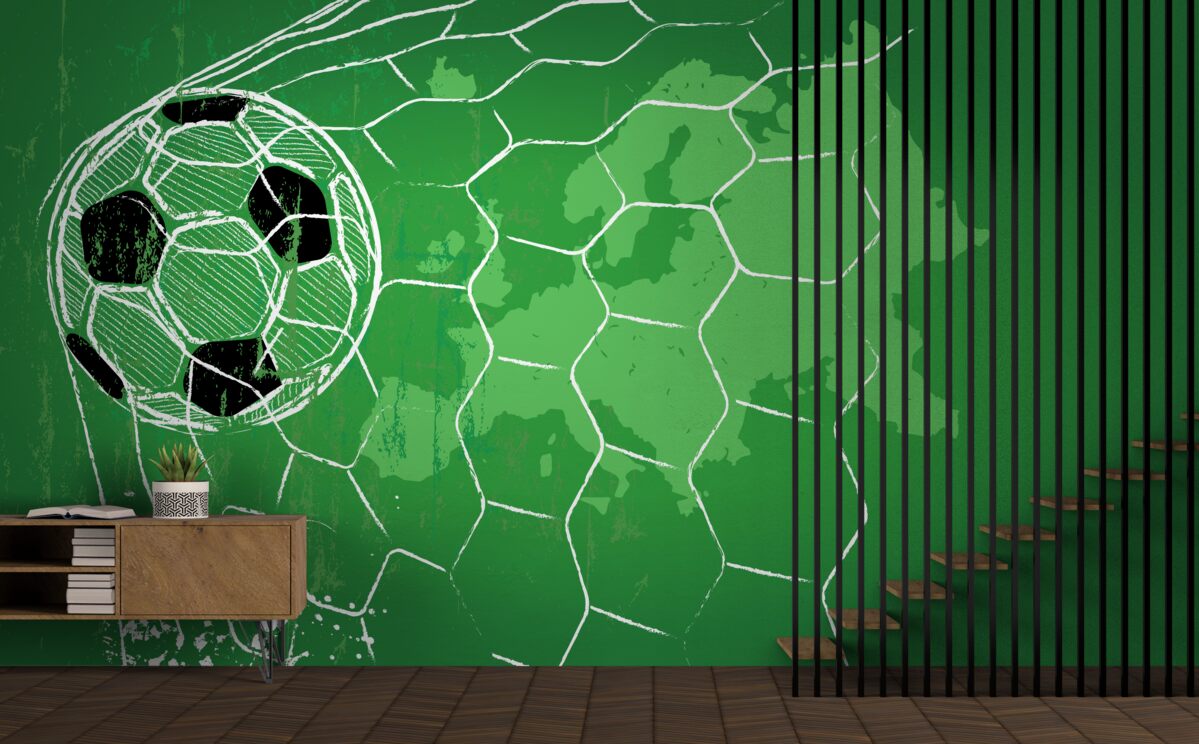 Fotobehang contour van een voetbal en een net tegen een groene achtergrond