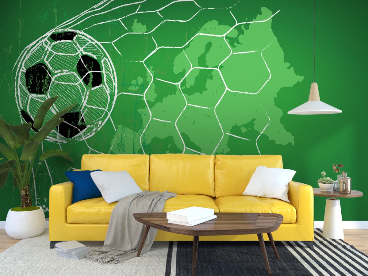 Fotobehang contour van een voetbal en een net tegen een groene achtergrond