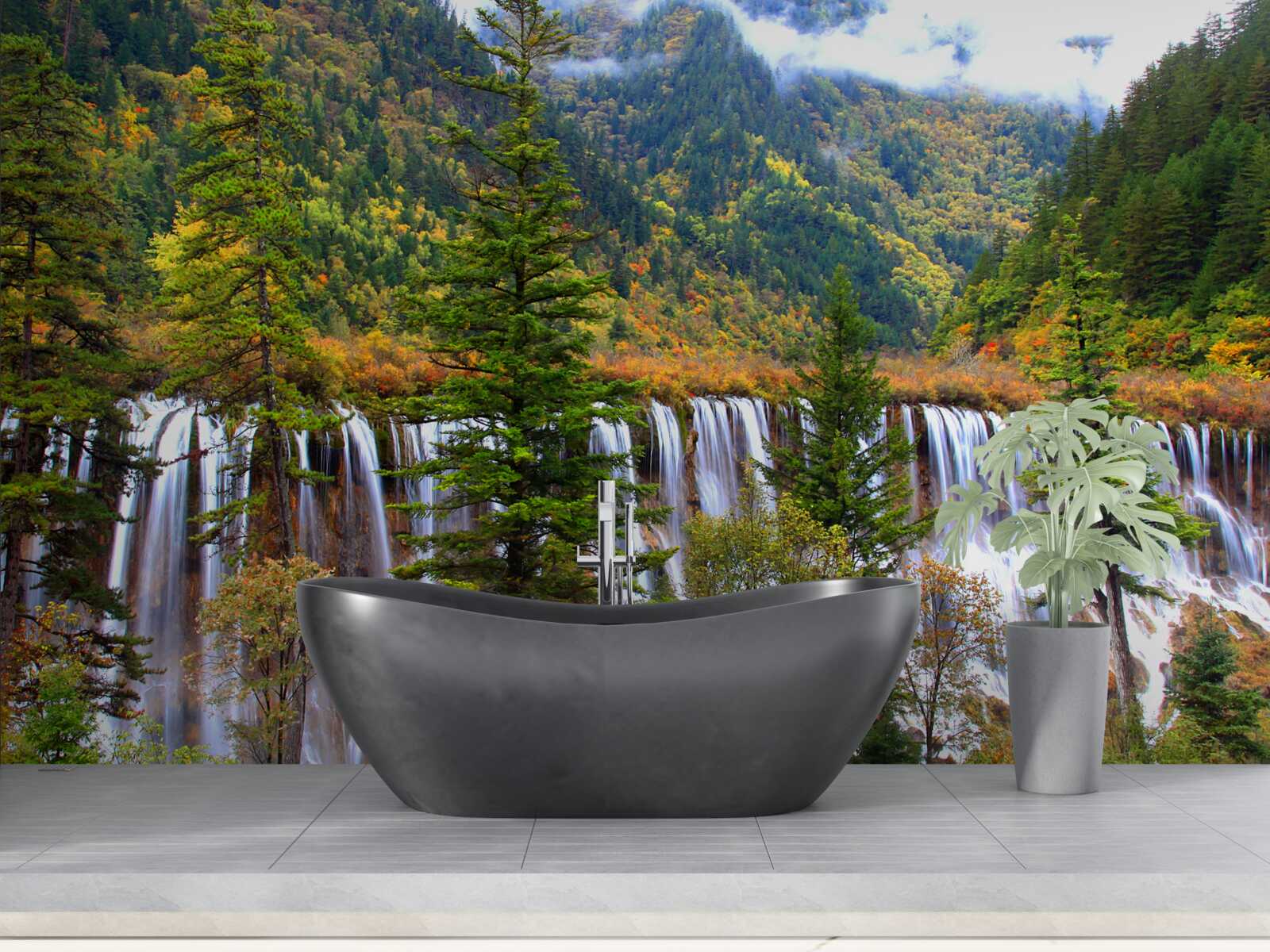 Fotobehang een enorme waterval die langs de berghelling naar beneden stroomt