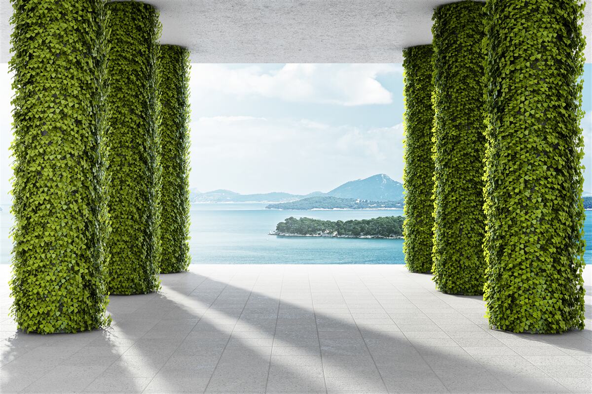 Fotobehang zuilengalerij tussen het groen die naar de zee leidt