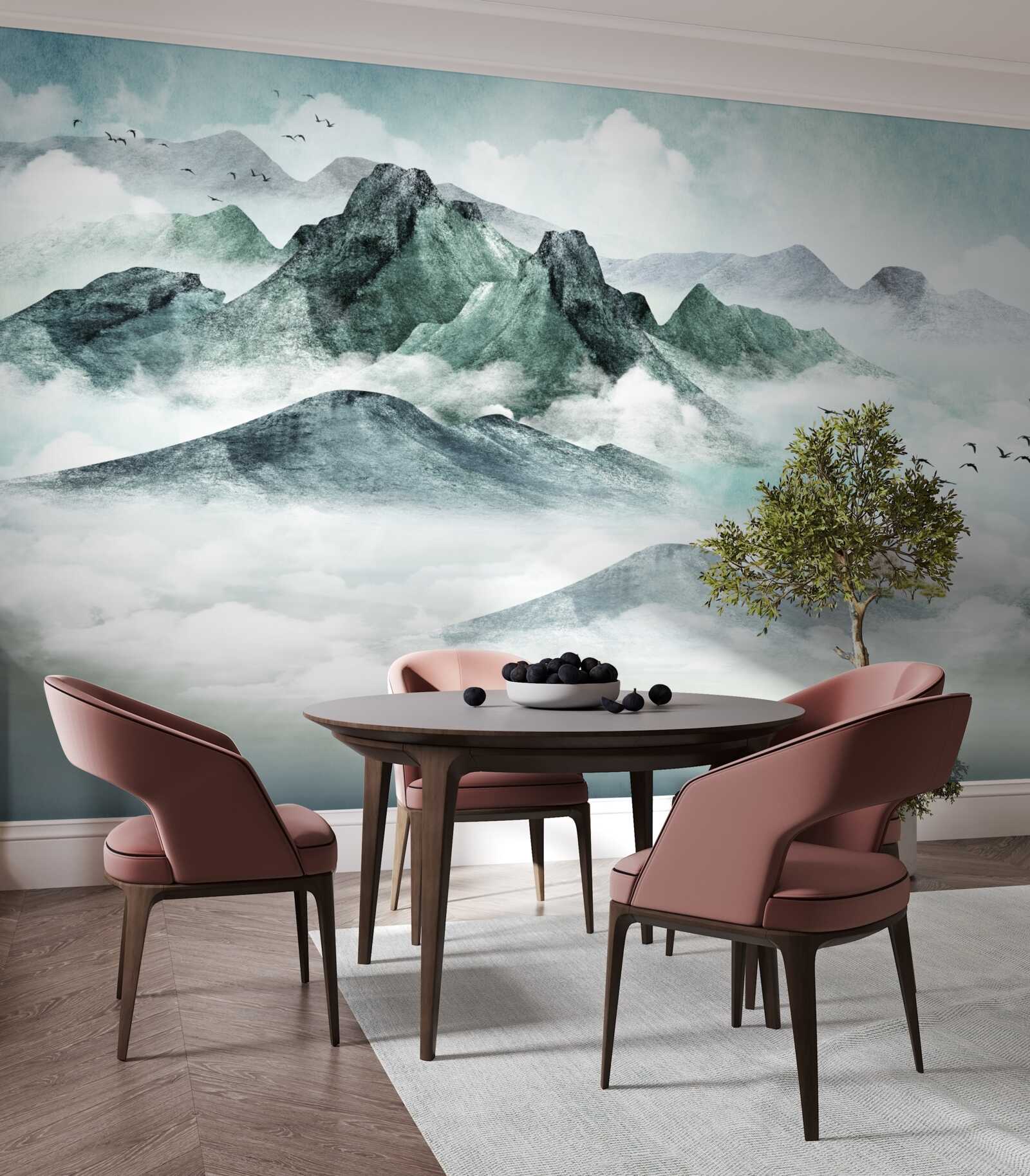 Fotobehang landschap van rotsachtige bergen omgeven door mist