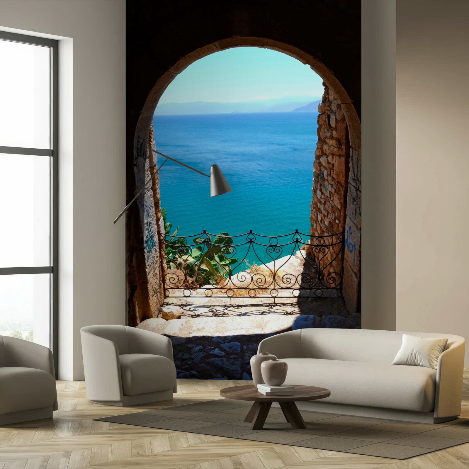 Fotobehang stenen boog die naar de zee leidt