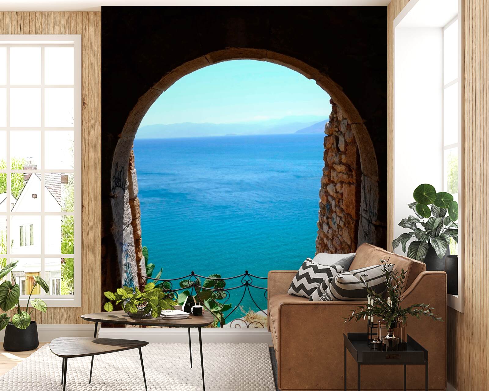 Fotobehang stenen boog die naar de zee leidt