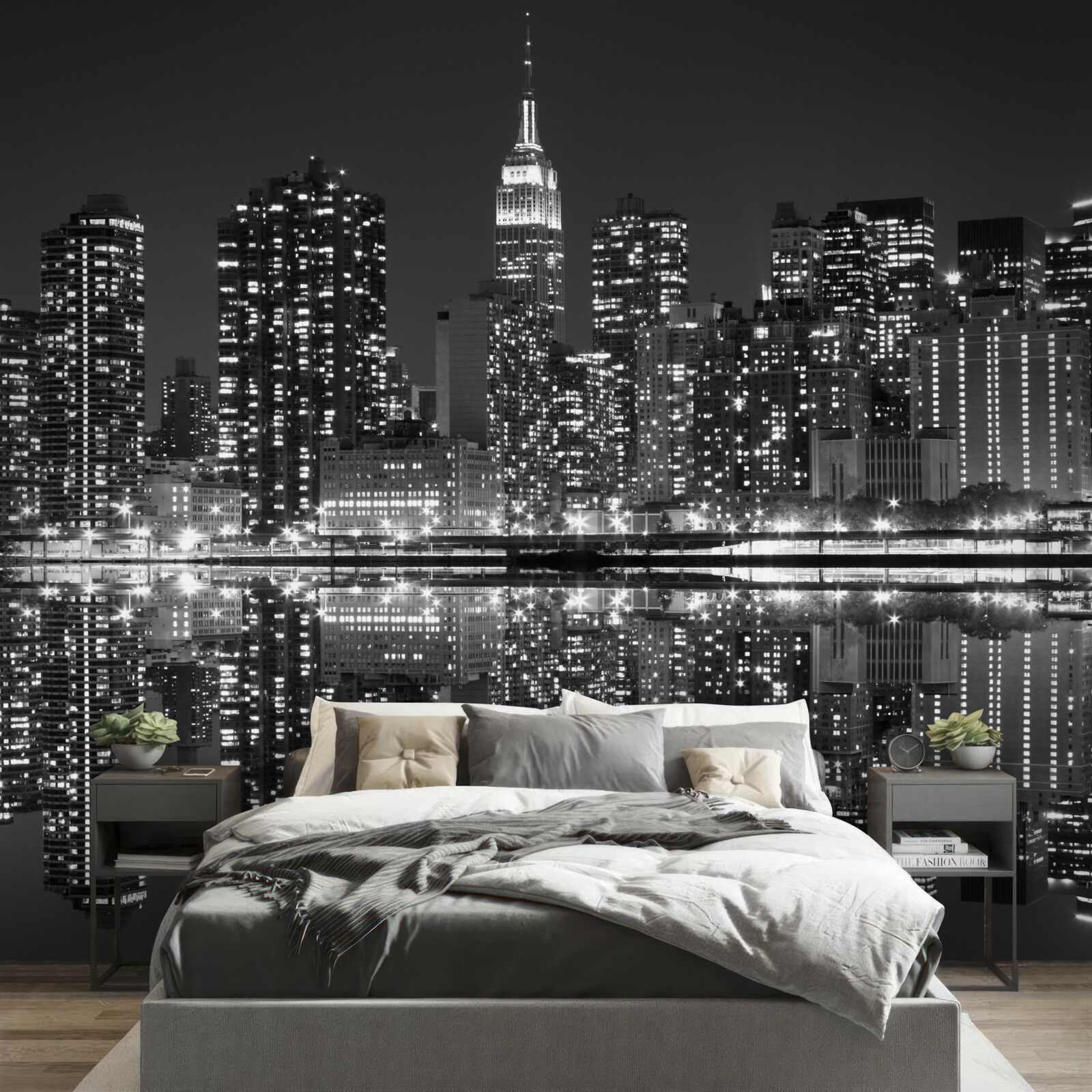 Fotobehang de skyline van de stad is zichtbaar in de weerspiegelingen van het water