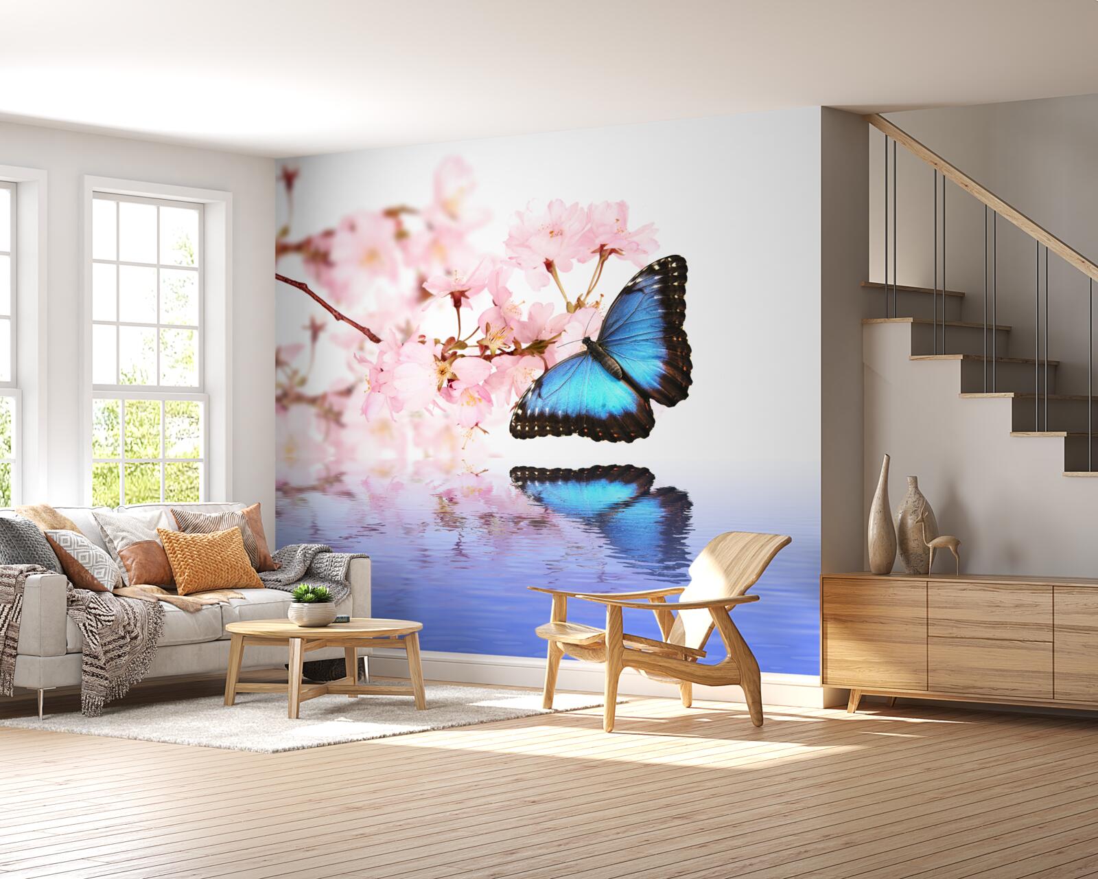 Fotobehang een blauwe vlinder zit op een kersenboom bij het water