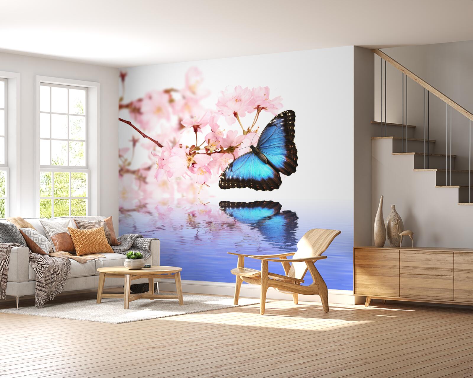 Fotobehang een blauwe vlinder zit op een kersenboom bij het water