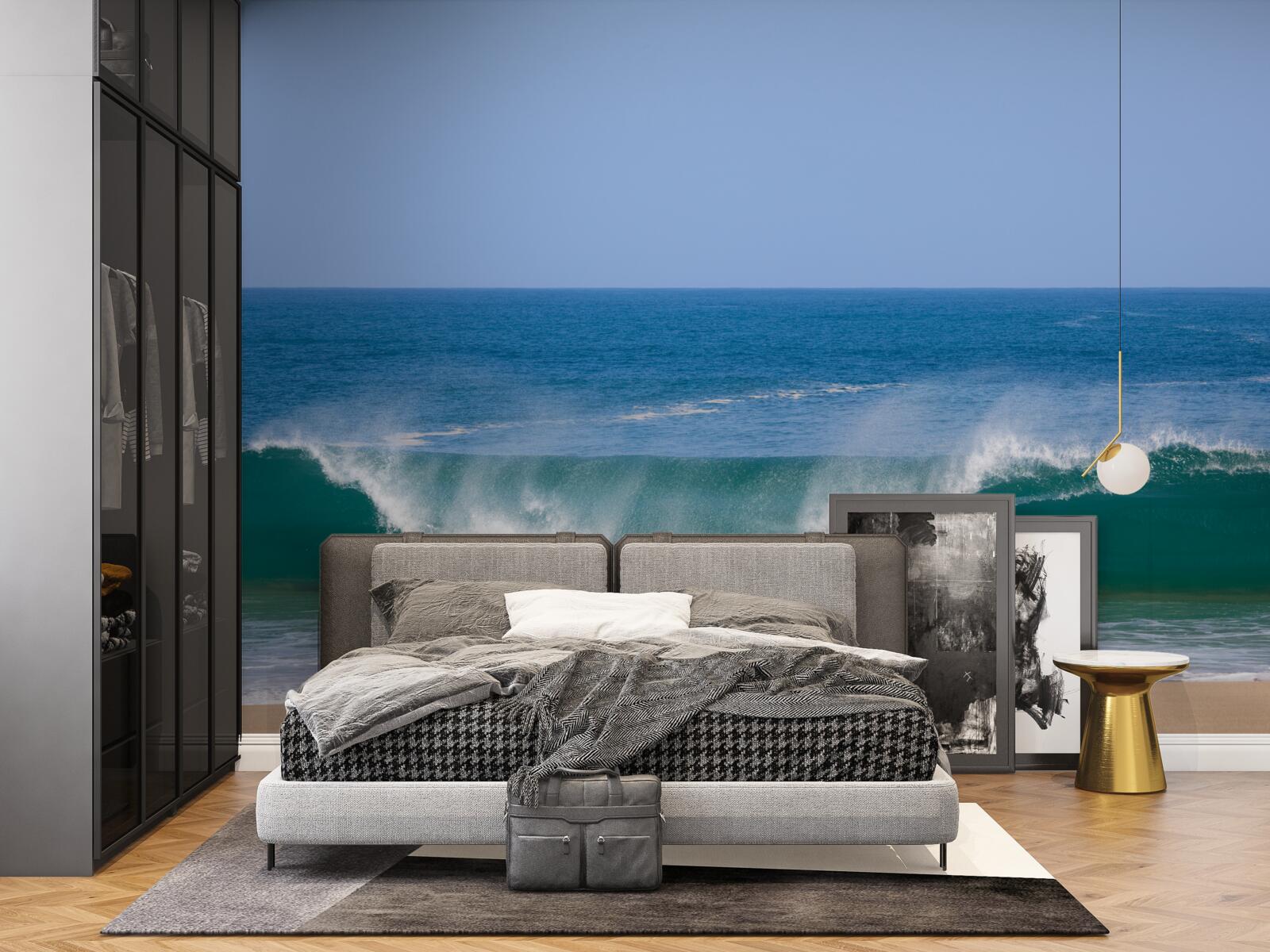 Fotobehang grote oceaangolven voor de kust