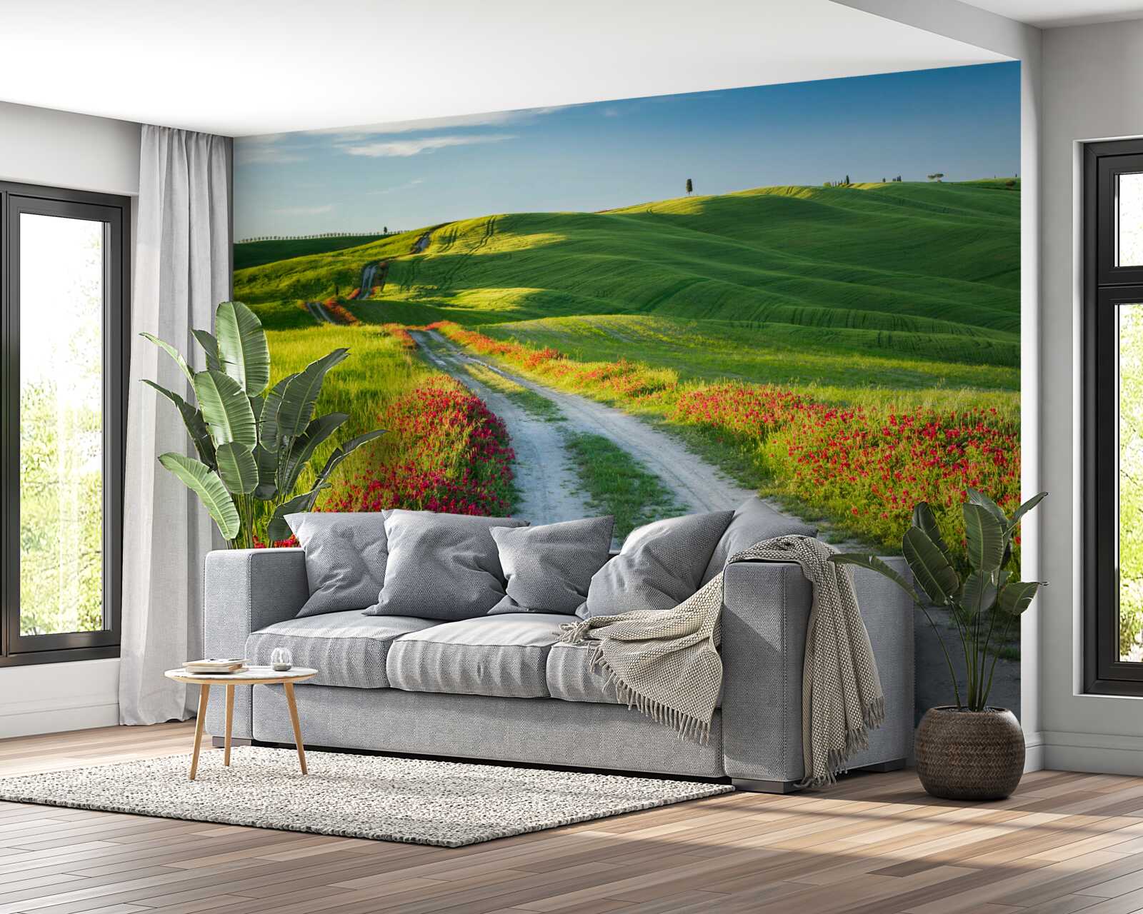 Fotobehang weg in de bergen omgeven door groene velden