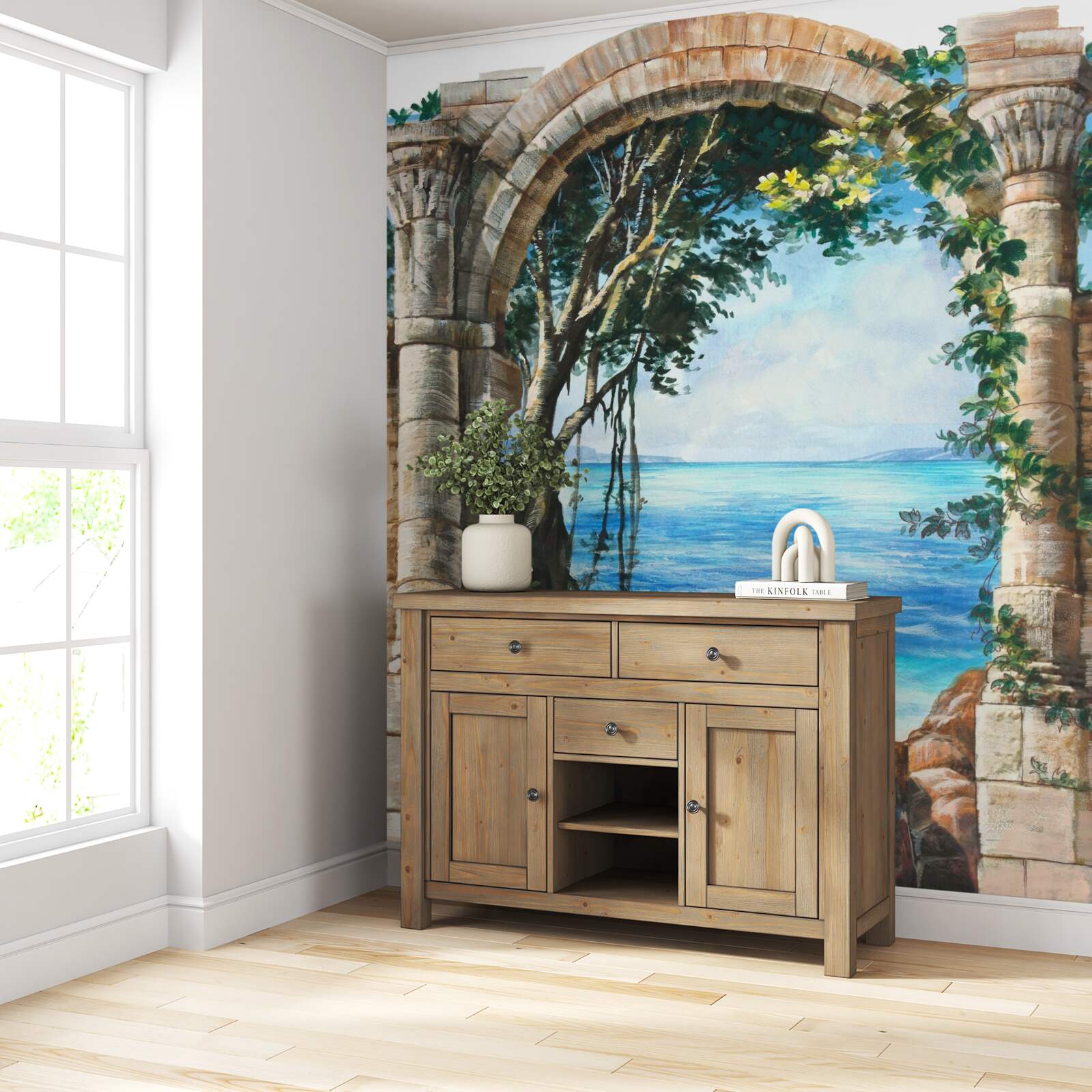 Fotobehang ronde stenen boog met uitzicht op zee