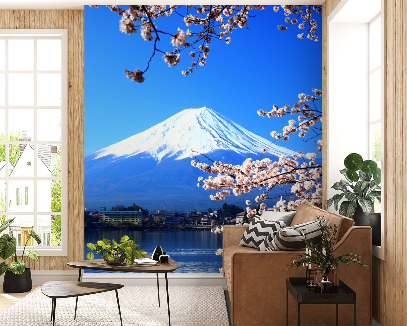 Fotobehang kersenbloesems op een achtergrond van een meer en een bergtop