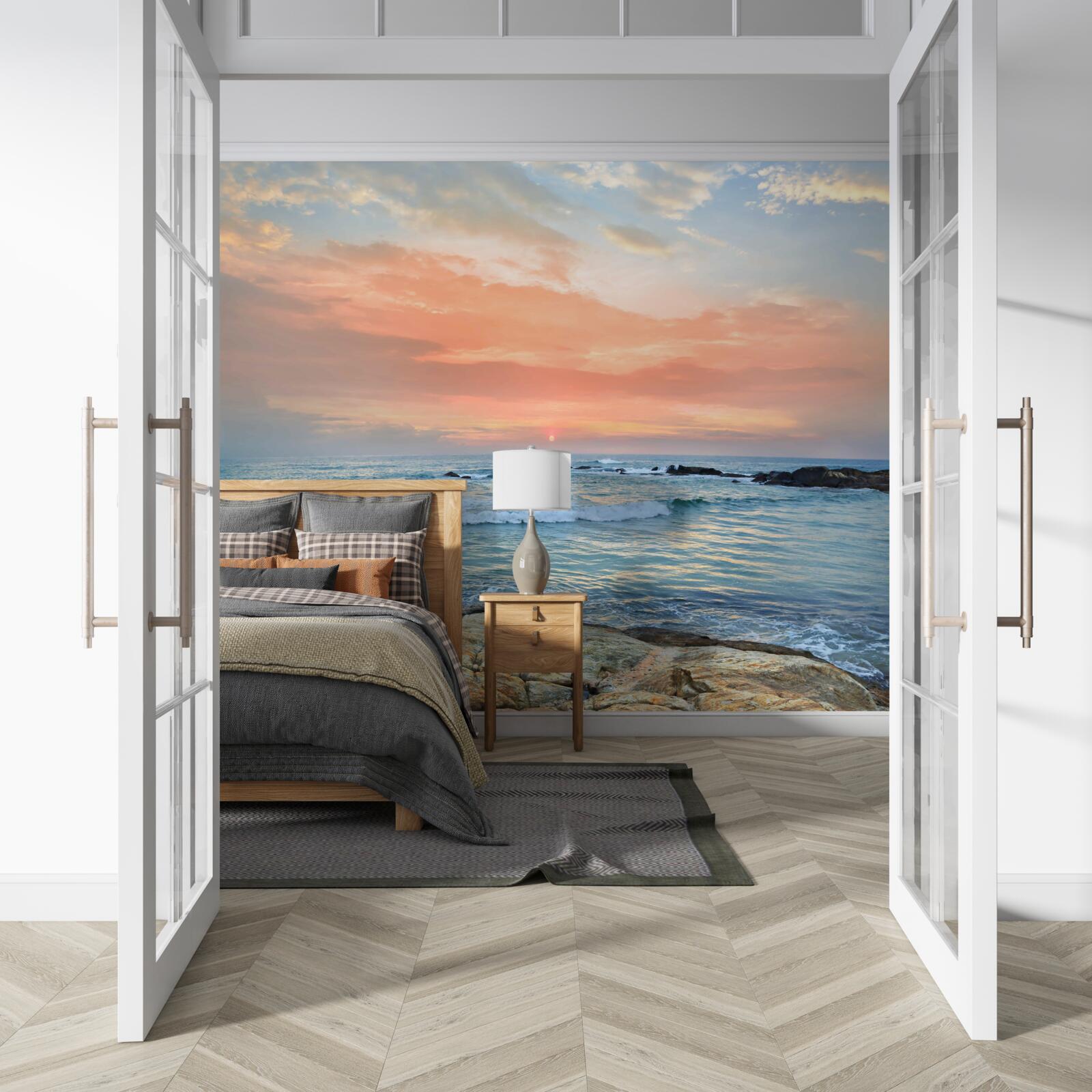 Fotobehang oceaan die zich uitstrekt tot de horizon en een roze zonsondergang